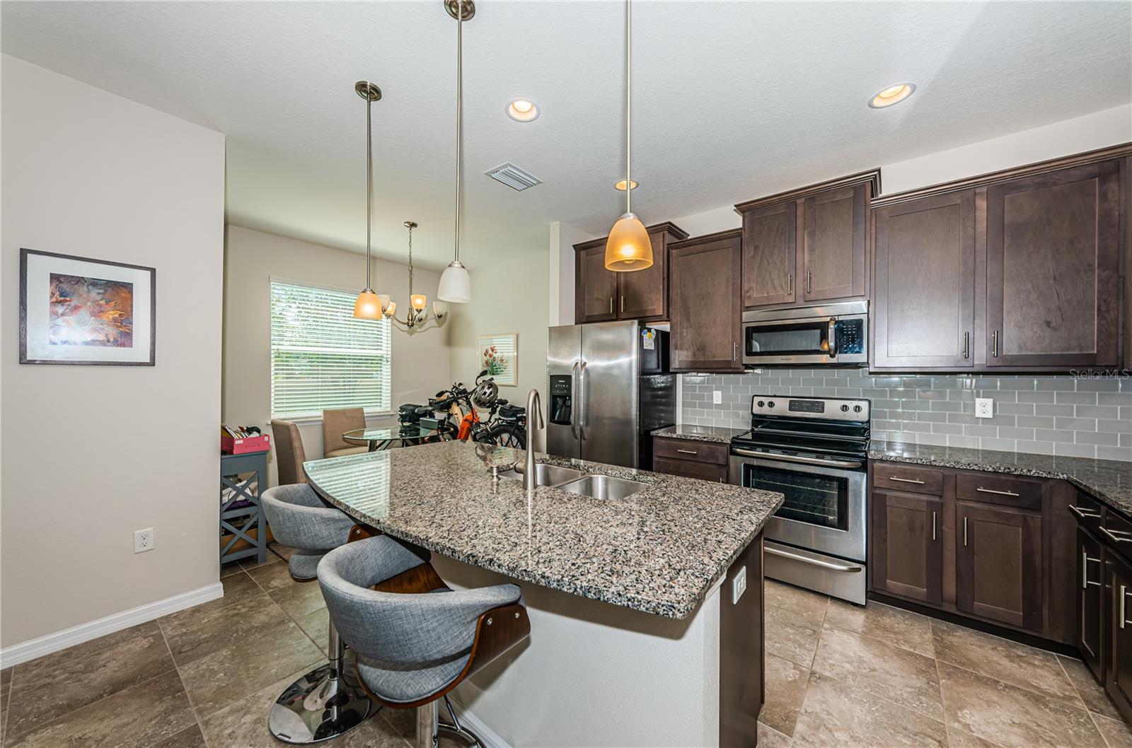 Kitchen with breakfast bar and eat in area