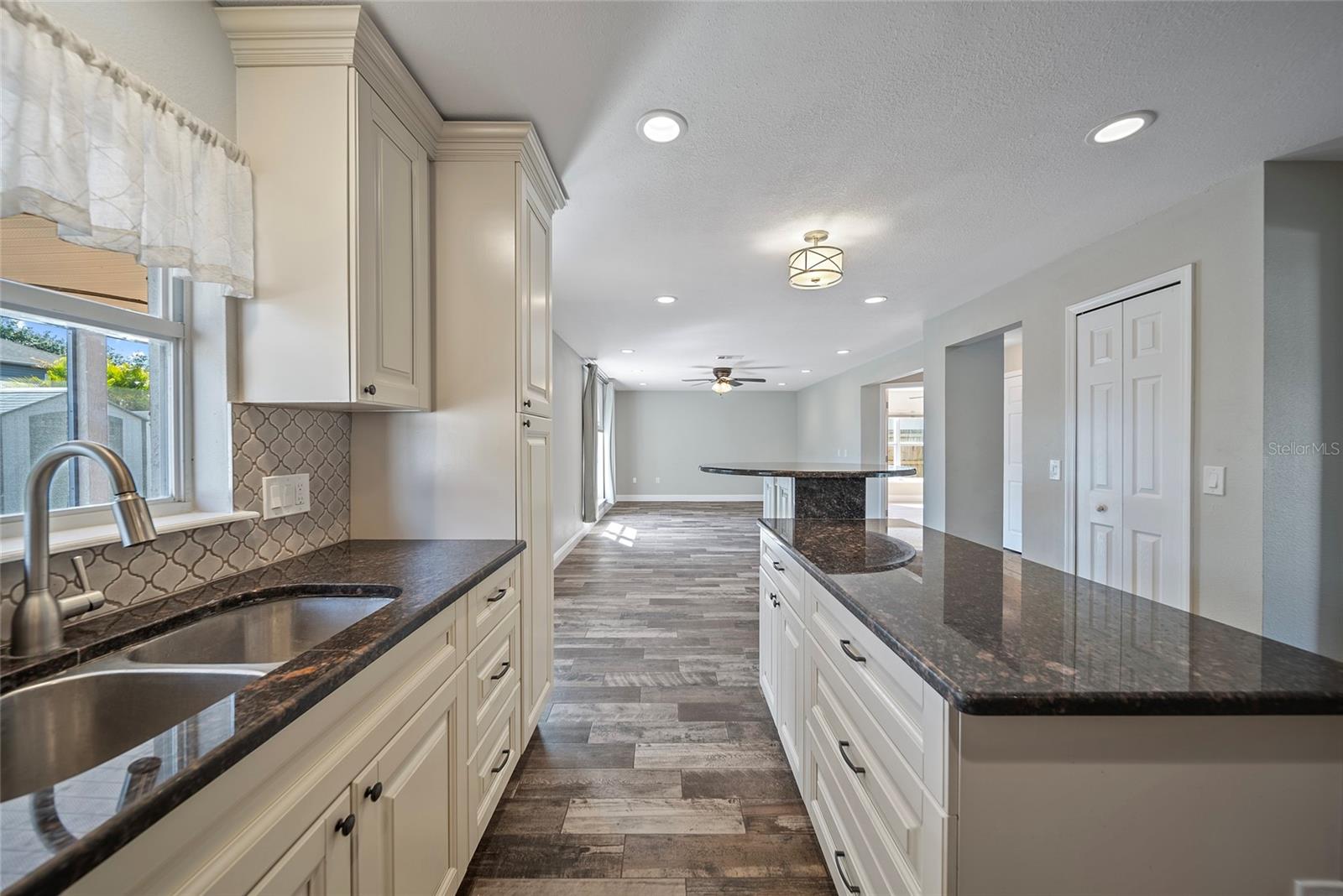 View of kitchen looking towards living room and office/bonus room