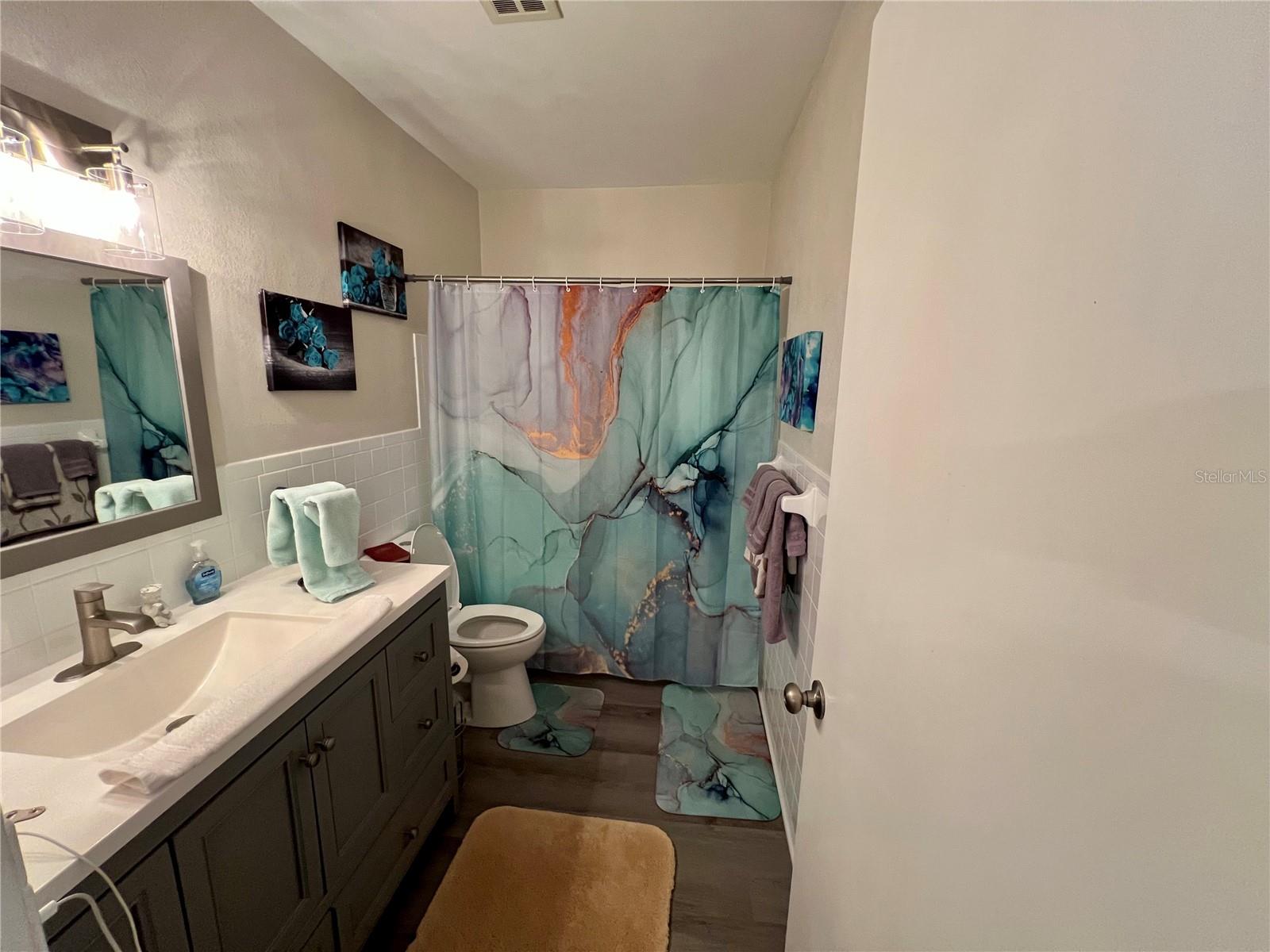 Shower tub combo with large sink.