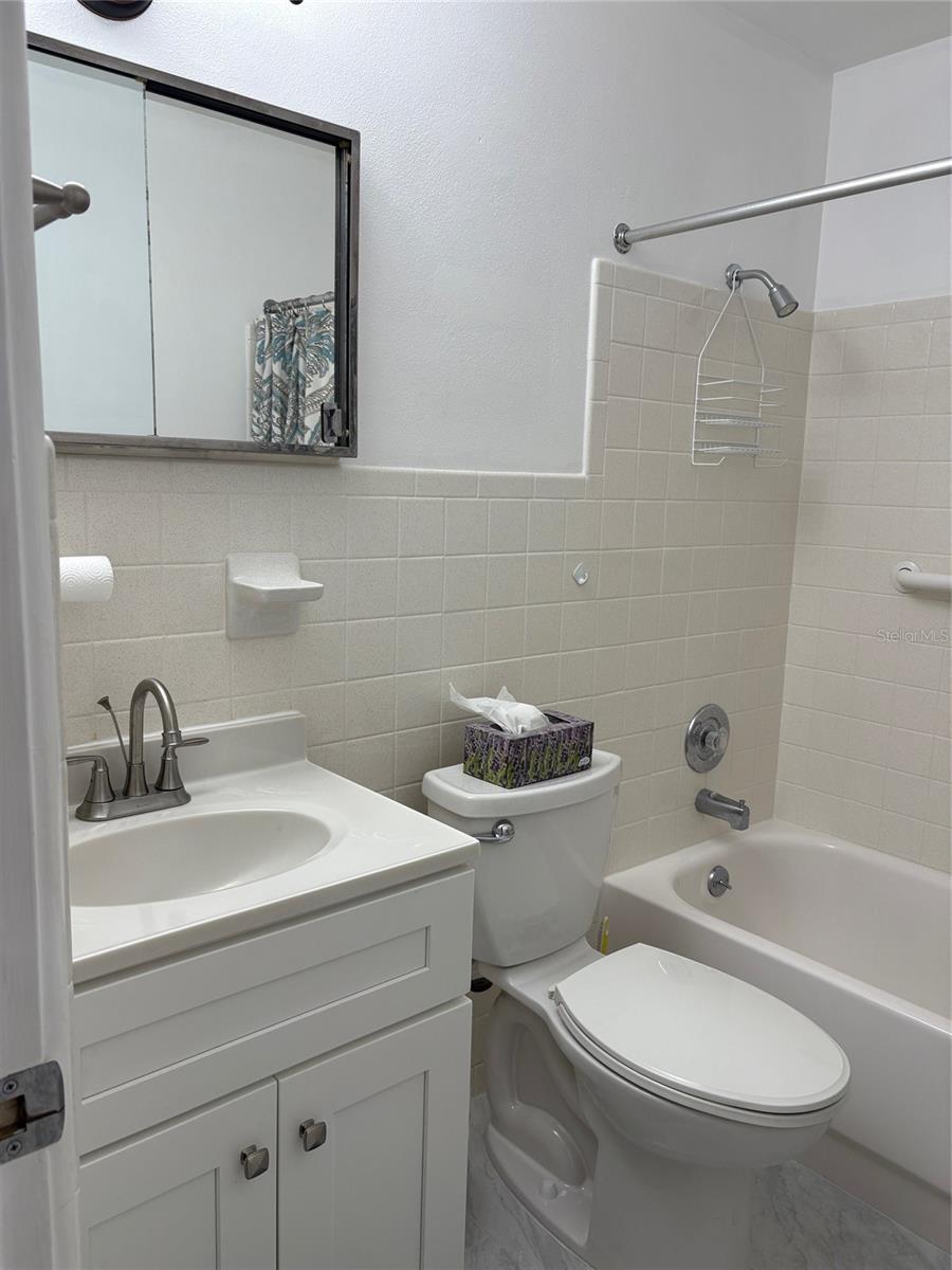 New tile, vanity, and fixtures