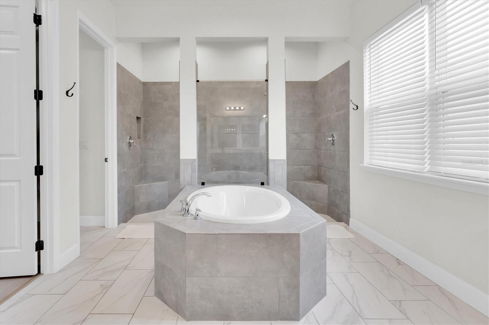 IMPRESSIVE SPA-LIKE PRIMARY ENSUOTE WITH DUAL ENTRY WALK IN SHOWER & GARDEN SOAKING TUB