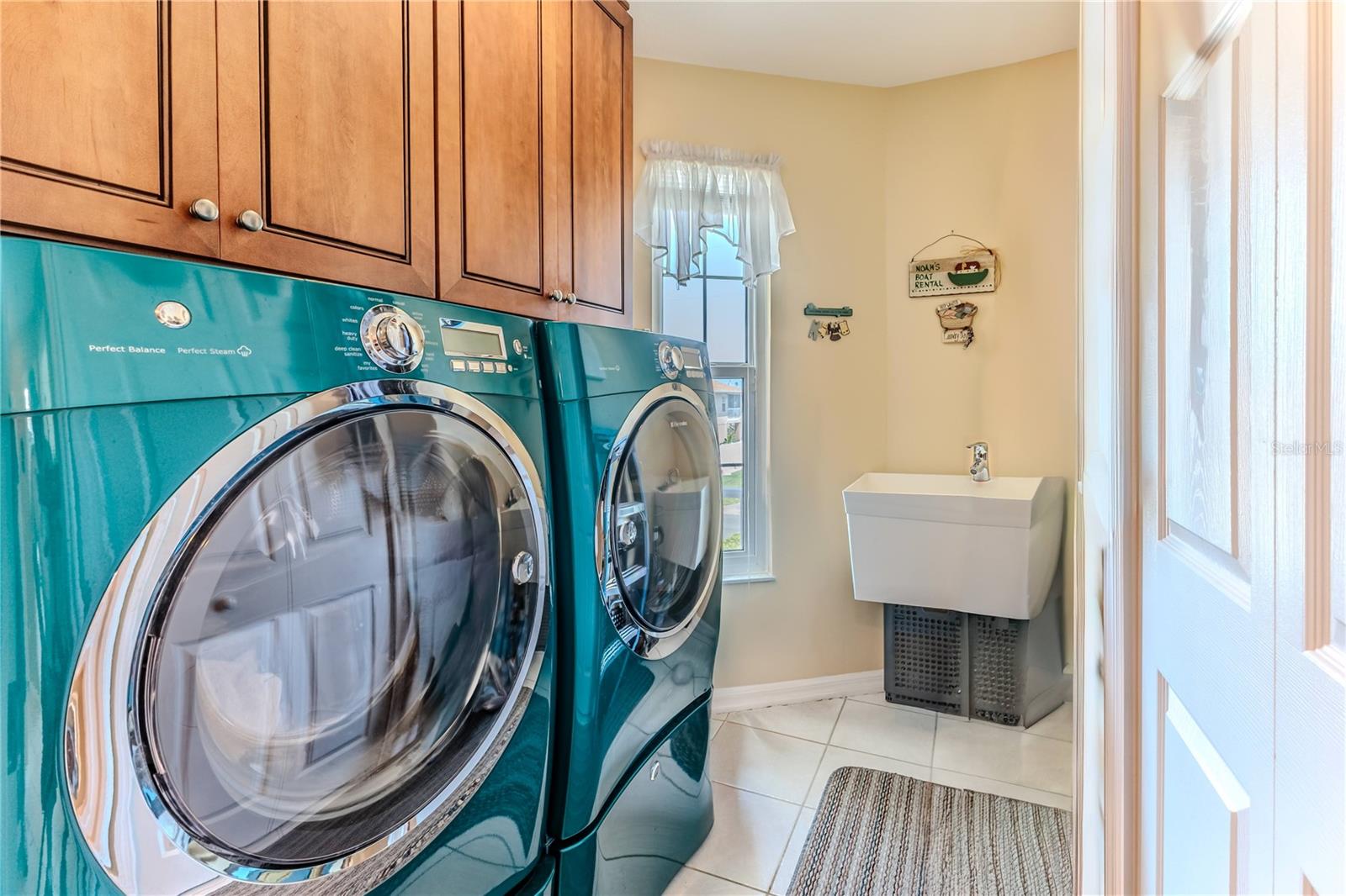 Laundry Room with Utility Sink, Washer and Dryer & Cabinets