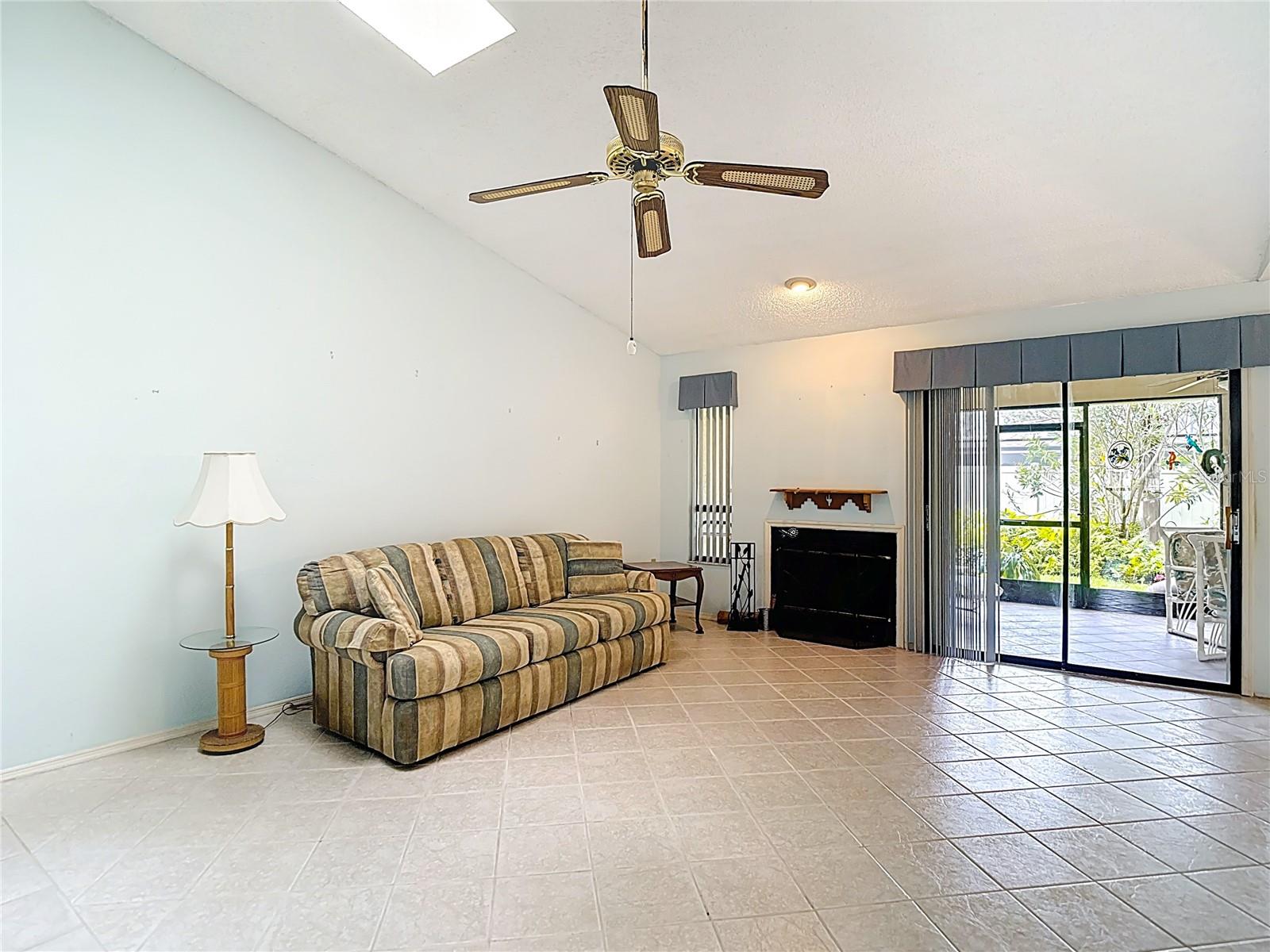 Living Room with double glass sliding doors to screened porch
