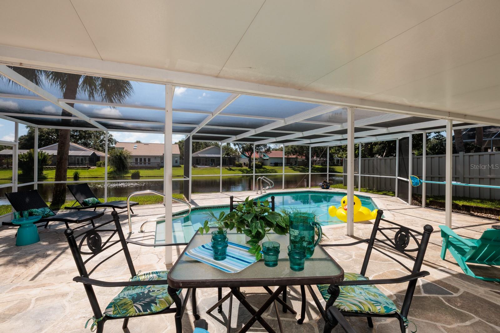 Outdoor Living Space has Pool and Lake View!