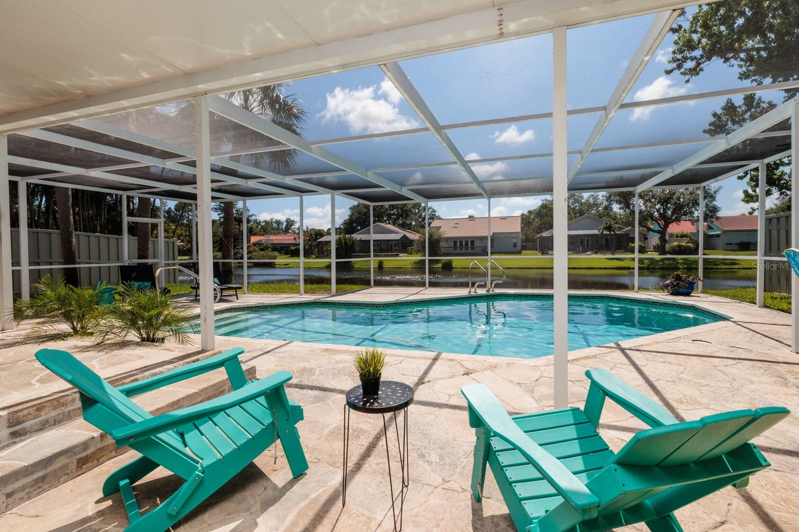 More Under Cover Living Area Off Master Bedroom With Pool and Lake Views.