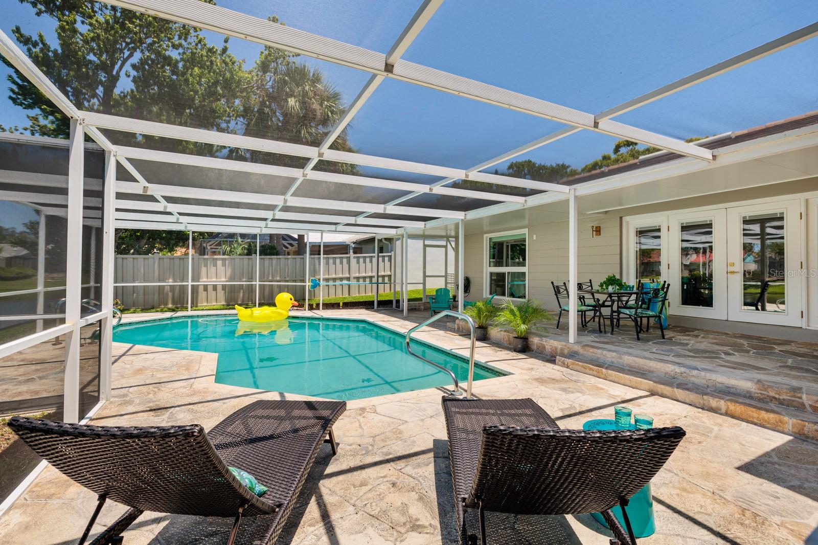 Screened Pool Offers Sunning Patio Areas as Well!