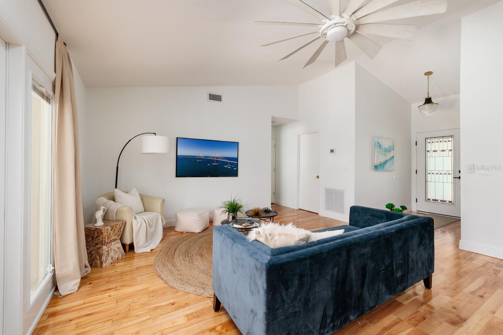 Living Room with Pitched Ceiling to Master Bedroom.
