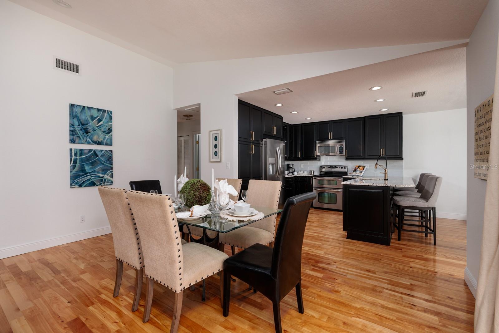 Dining Area into Chefs Kitchen. (Bedroom 2&3 off left.)
