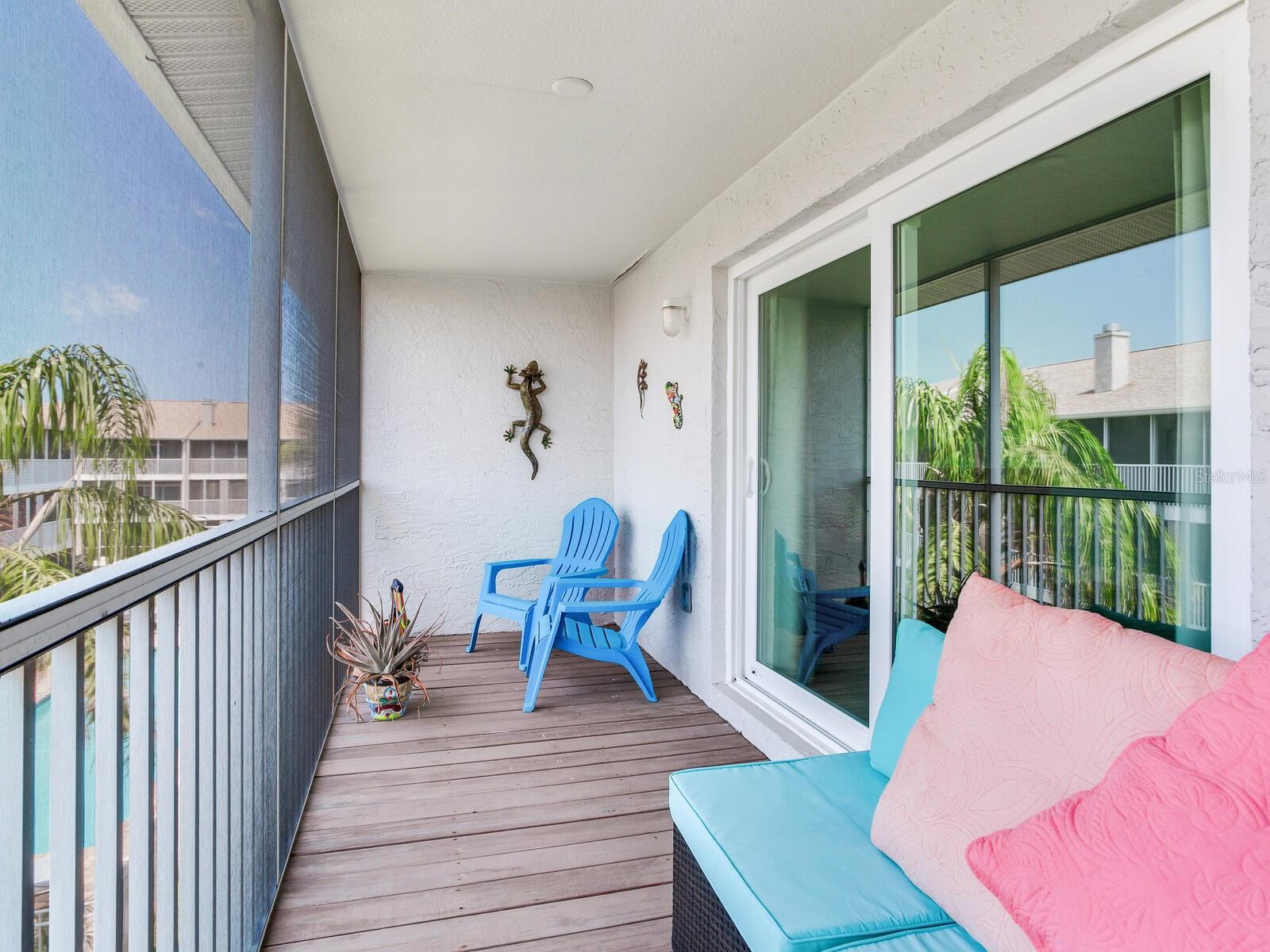 Screened in porch off master suite overlooking pool