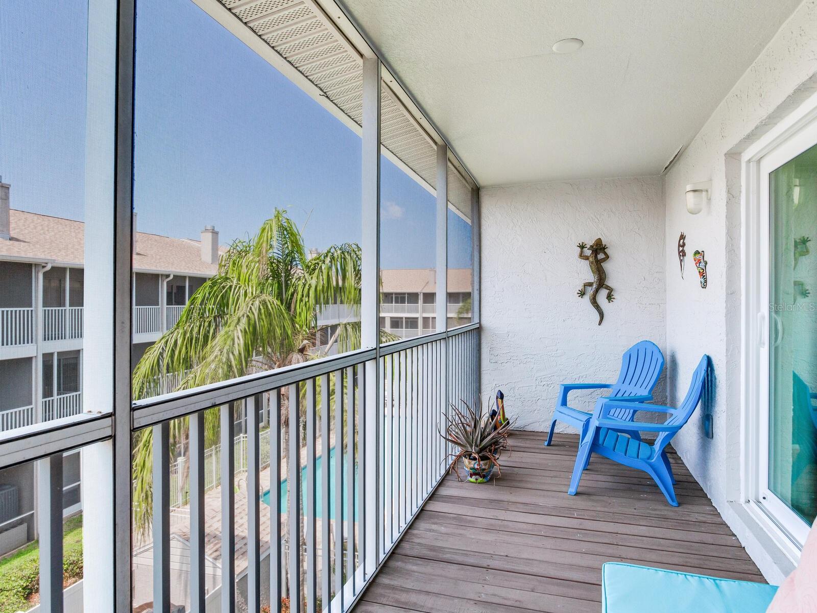 Screened in porch off master suite overlooking pool