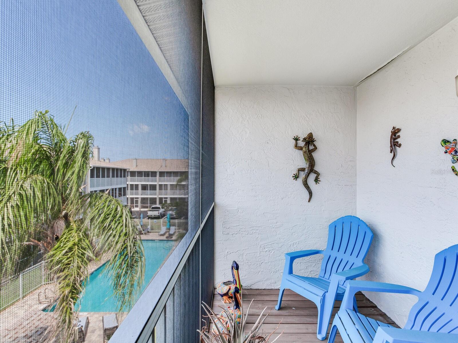 Screened in porch off master suite overlooking pool