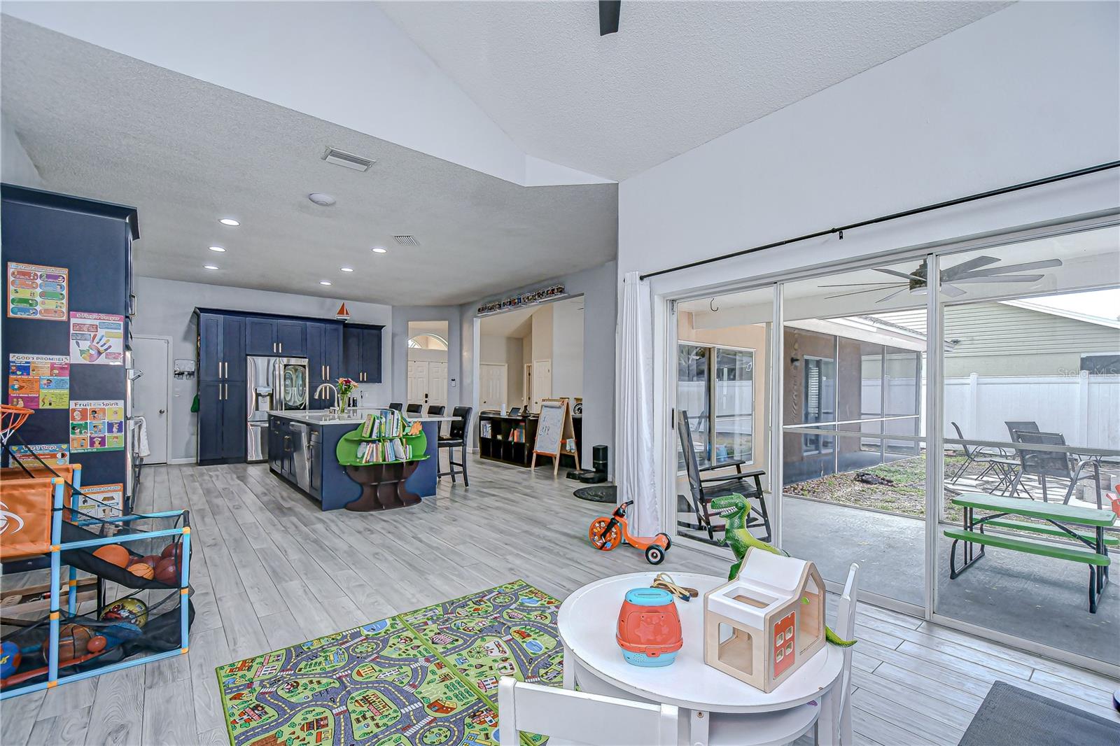 Family room has its own sliders and views of the fenced yard!