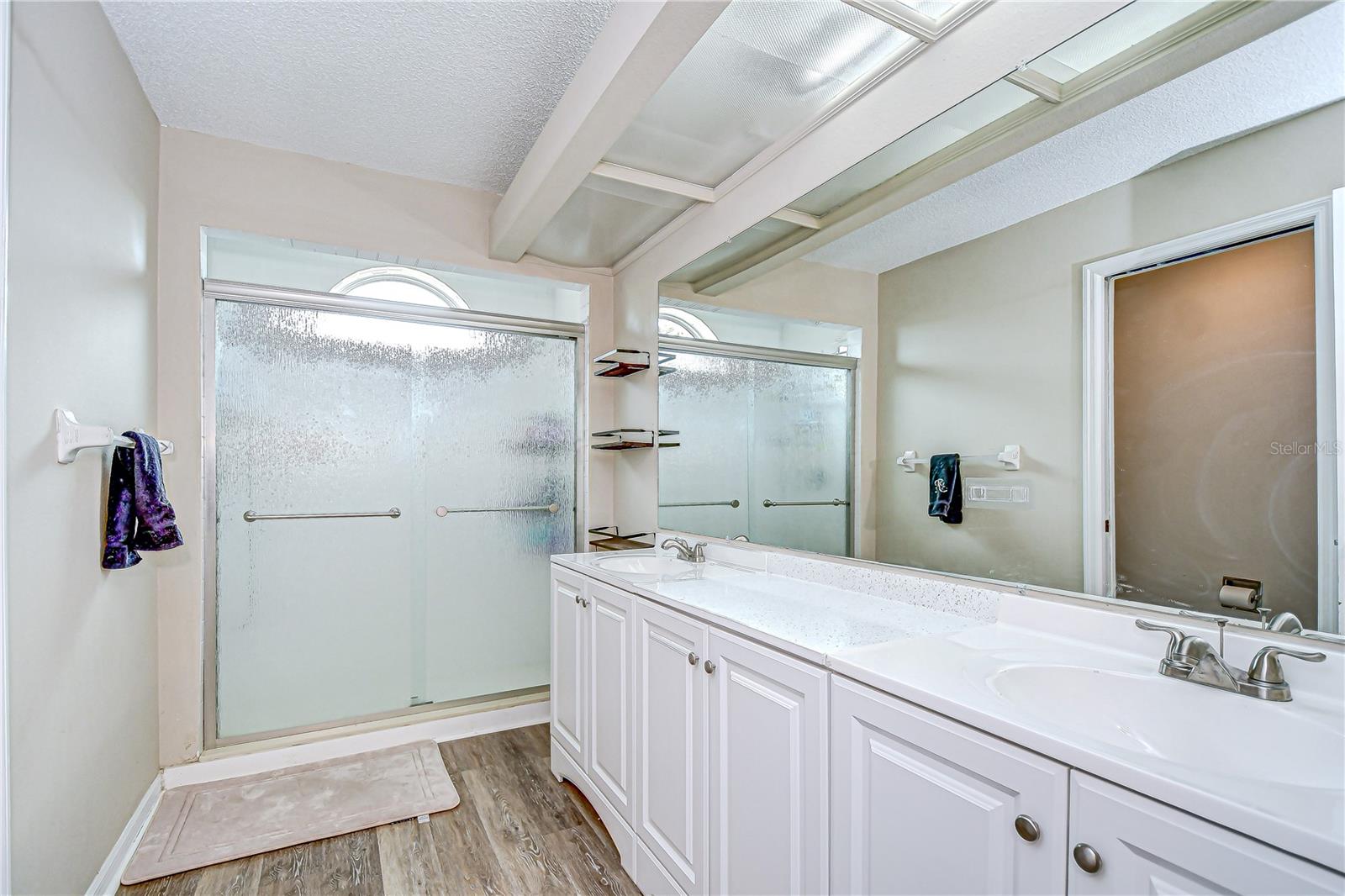 En-suite bathroom features dual sinks and walk-in shower!