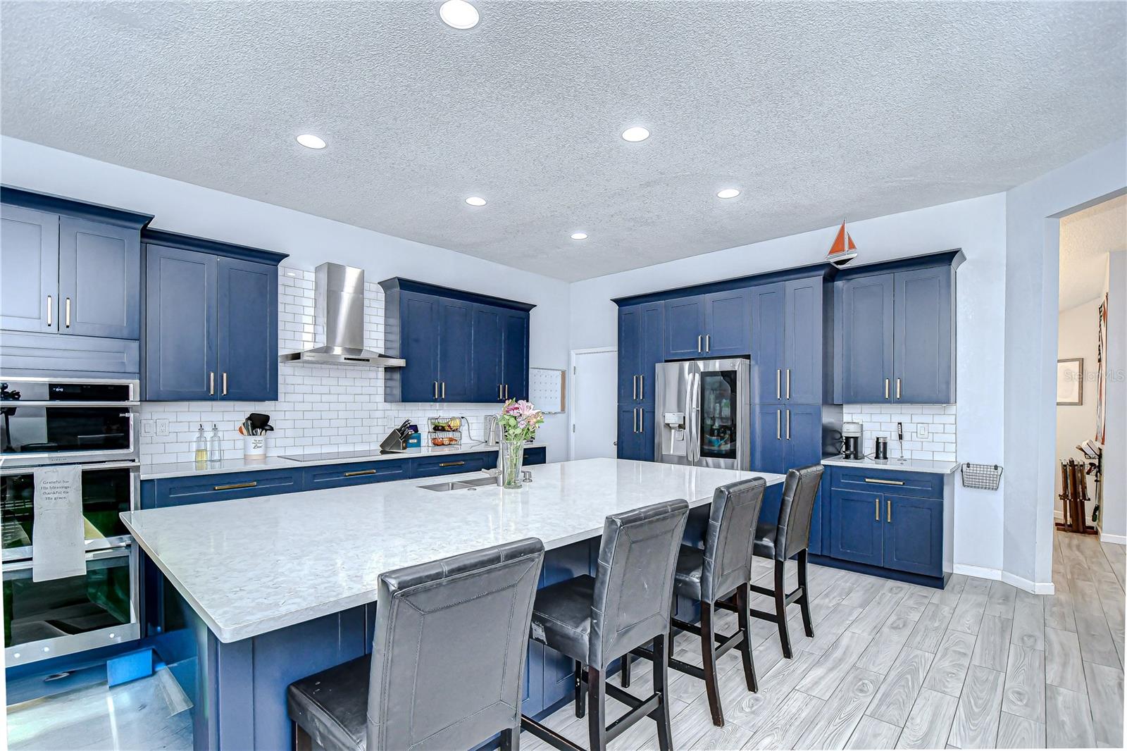 Completely remodeled in 2022, there are quartz counters, built-in stainless appliances, and ample cabinetry!