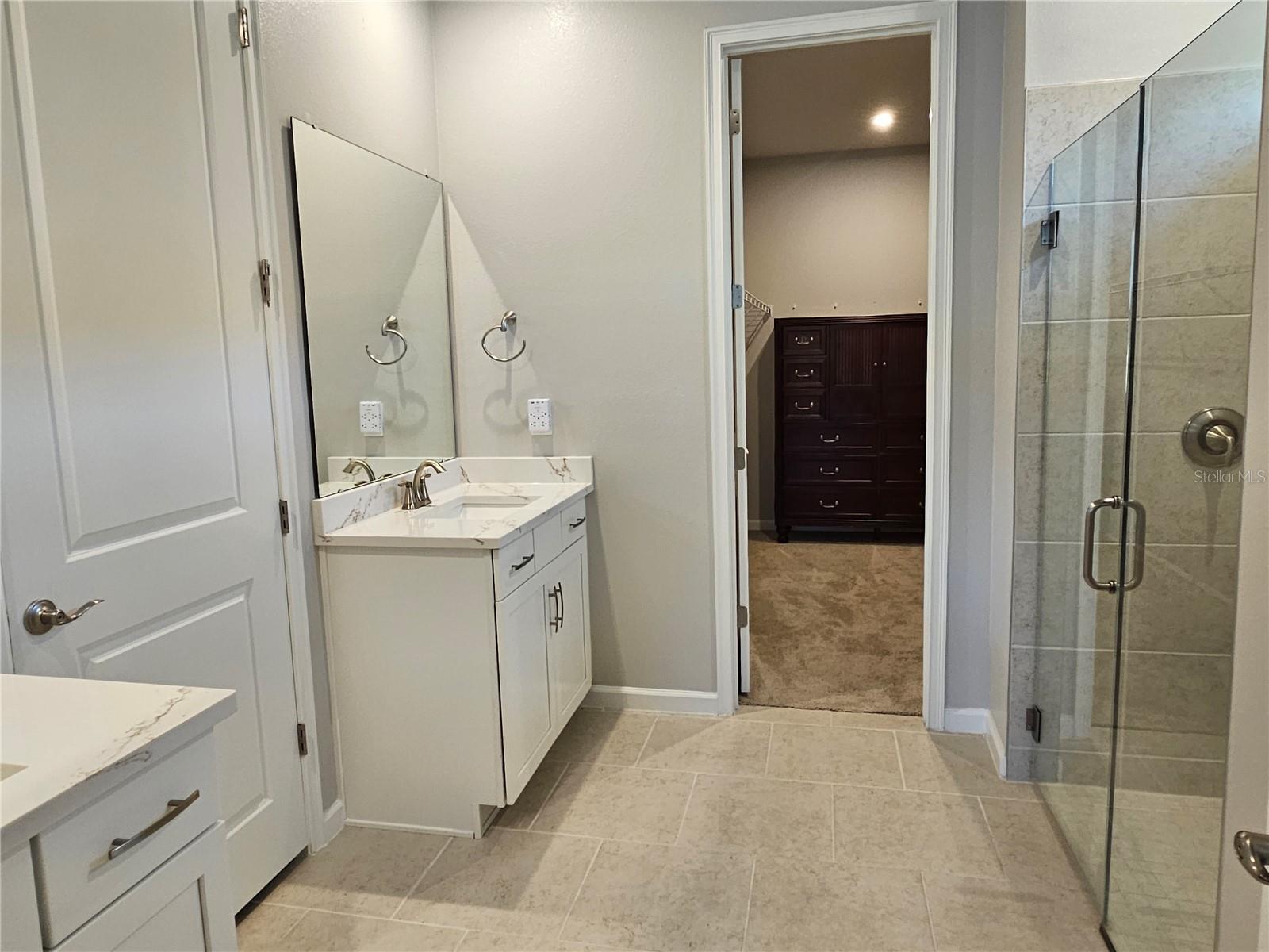 Primary Bathroom & walk-in closet