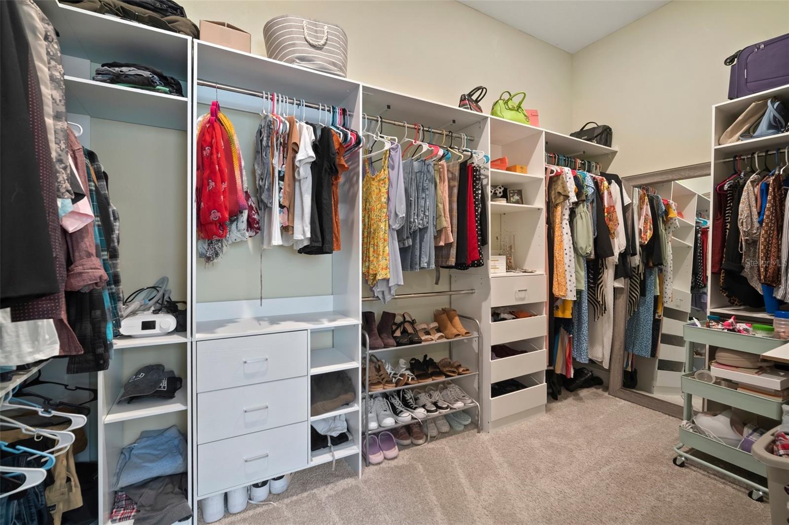 Oversized primary closet with new custom closet system