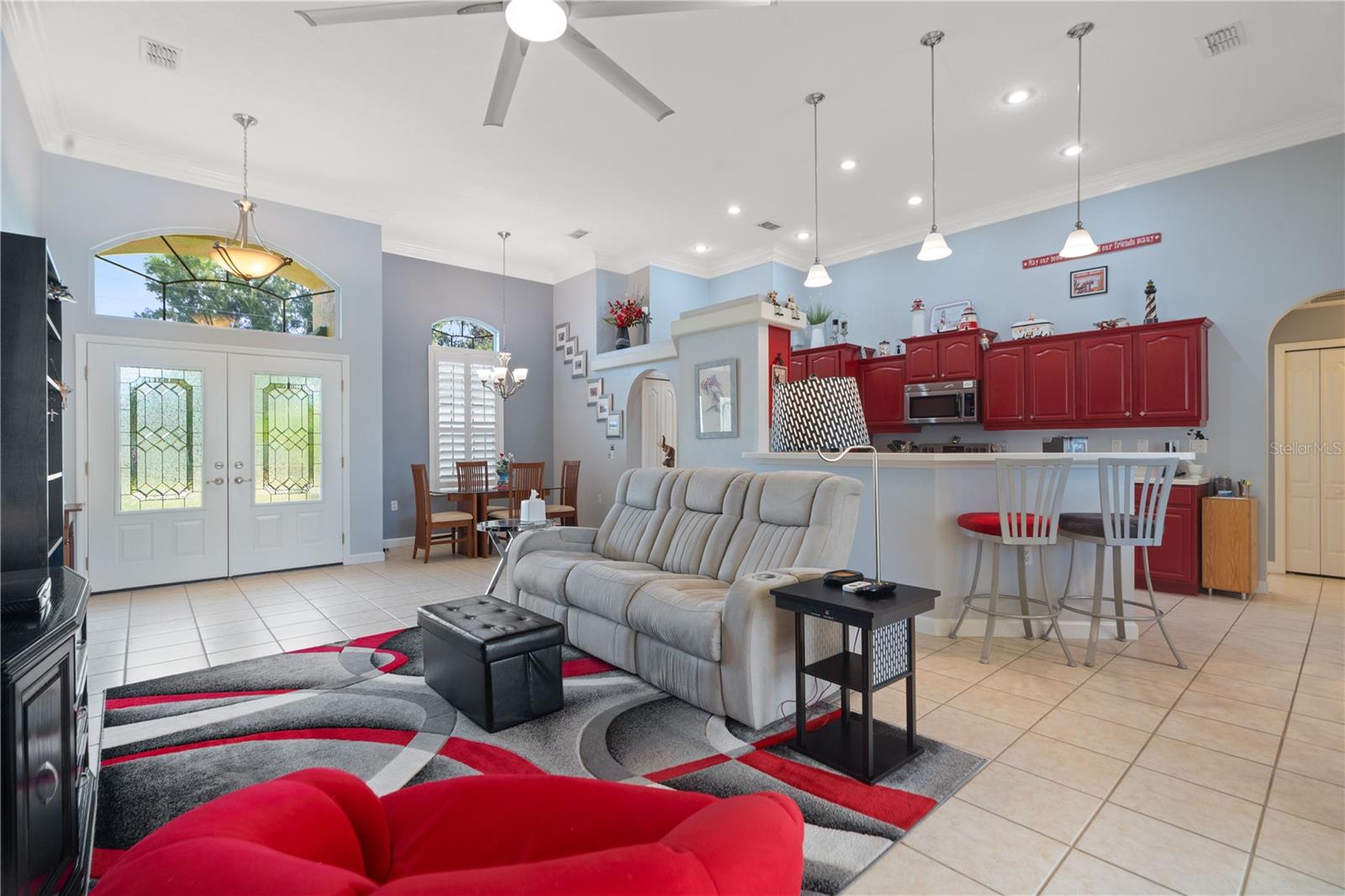 Ceramic flooring is prevalent in the living room, dining area, breakfast nook, kitchen and at the breakfast bar.