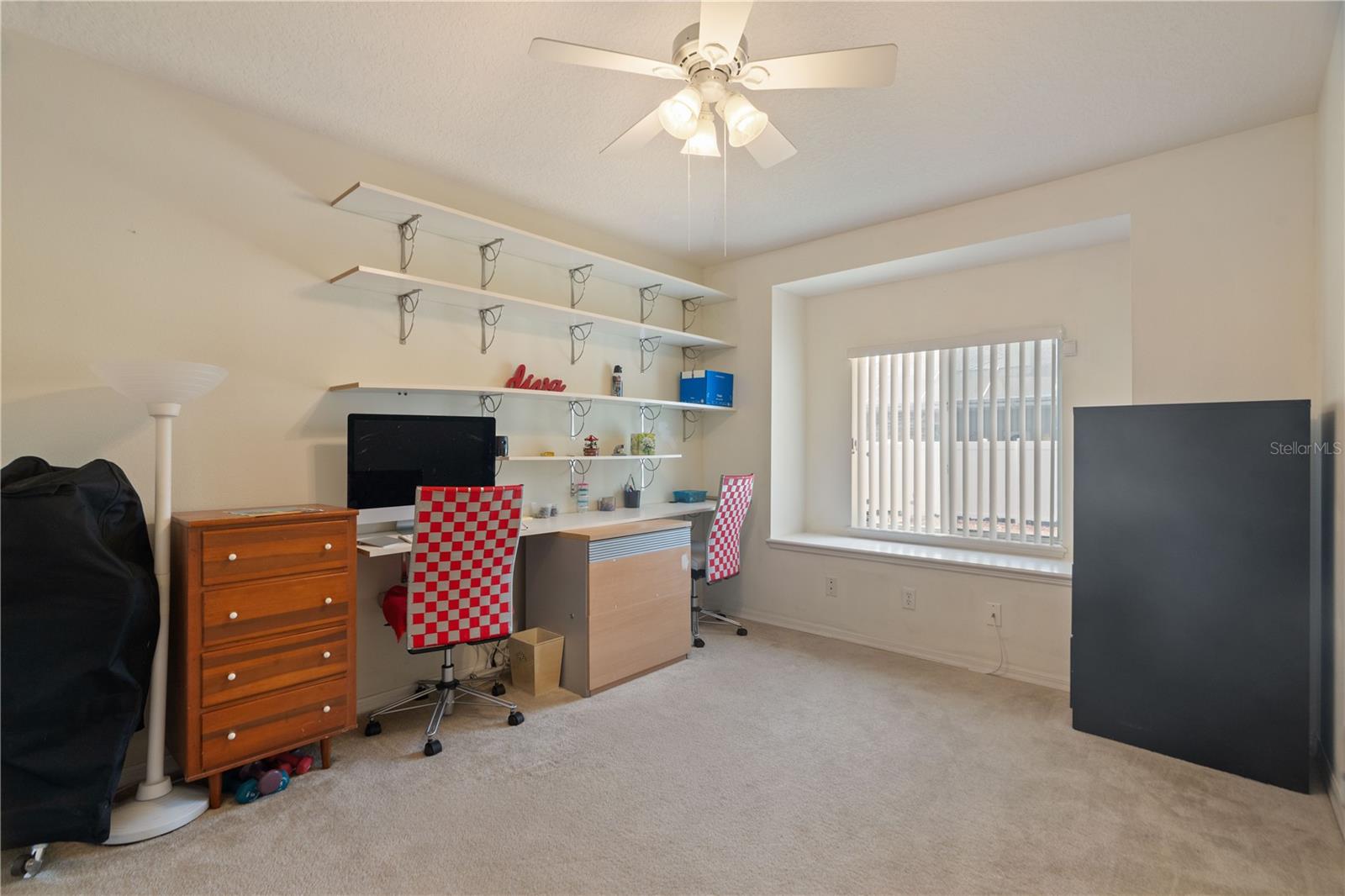 Second bedroom has a window seat also a great place to store extra books