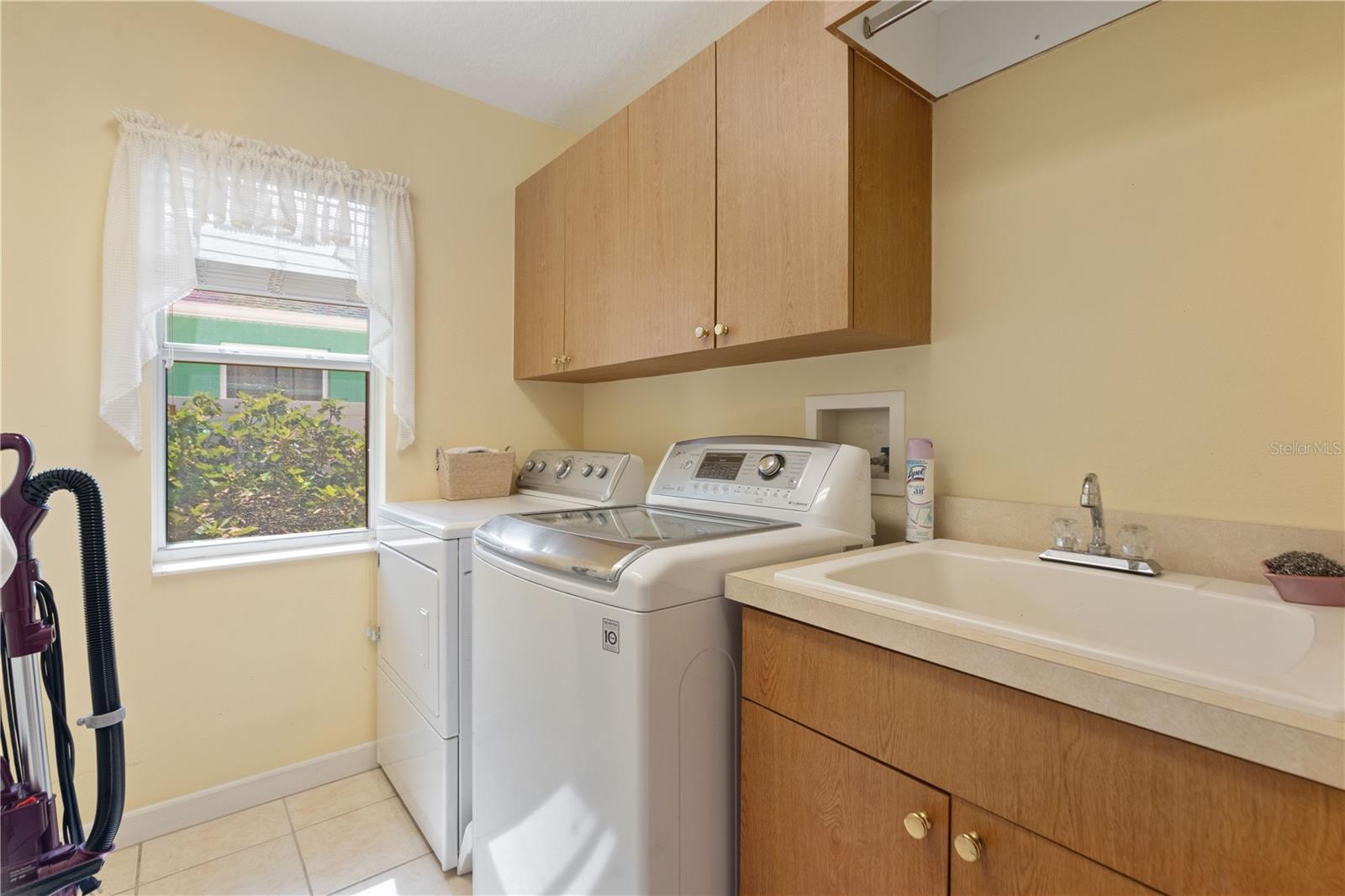 Indoor utility is near the kitchen and is air-conditioned. Large sink handy for hand-wash.