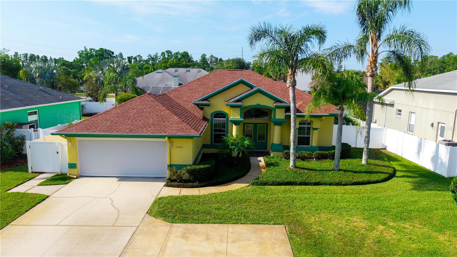 An additional parking pad for guests is parallel to the home.