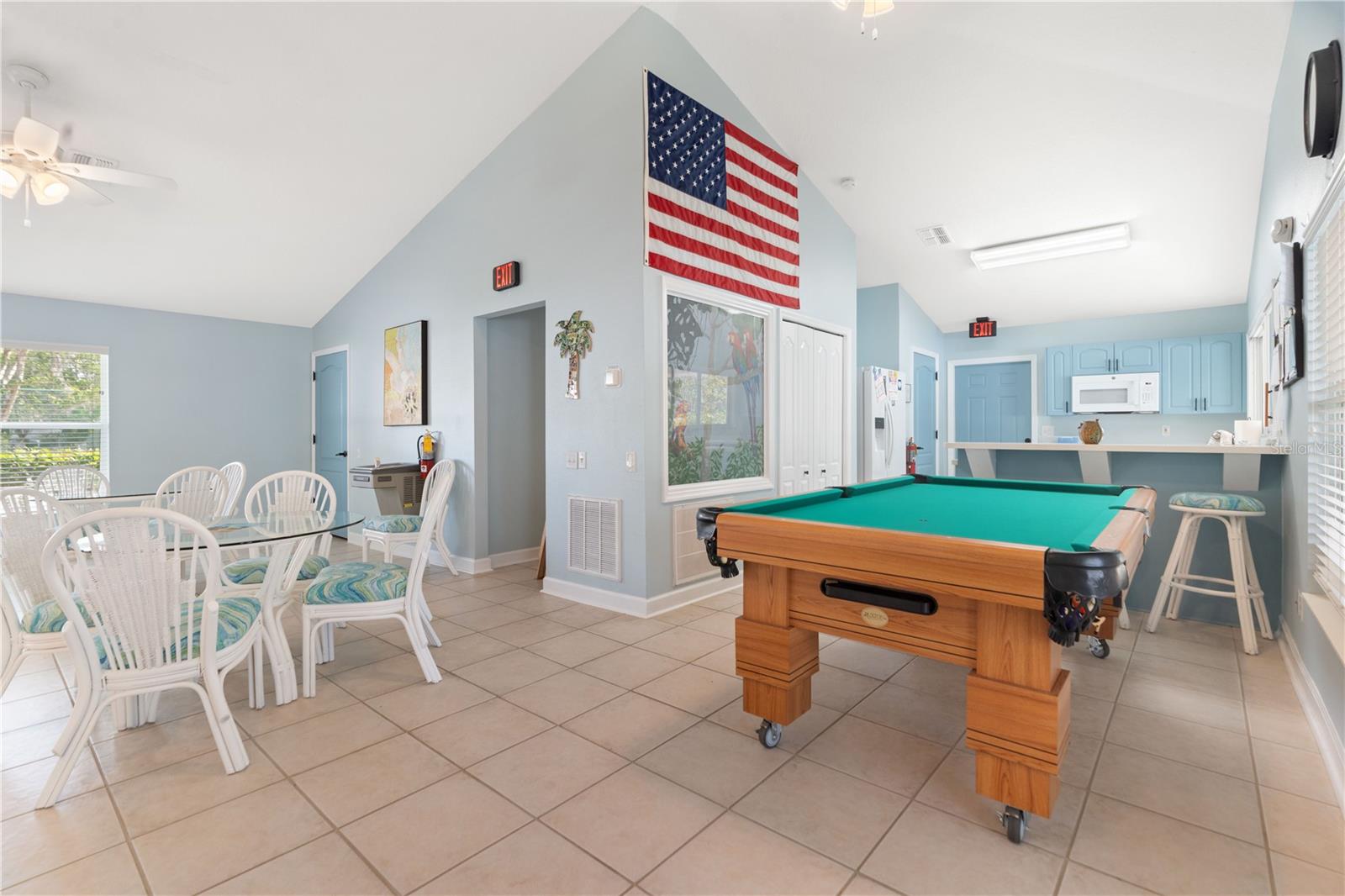 The pool table in the club house is on wheels as it serves as a buffet table during parties and events.
