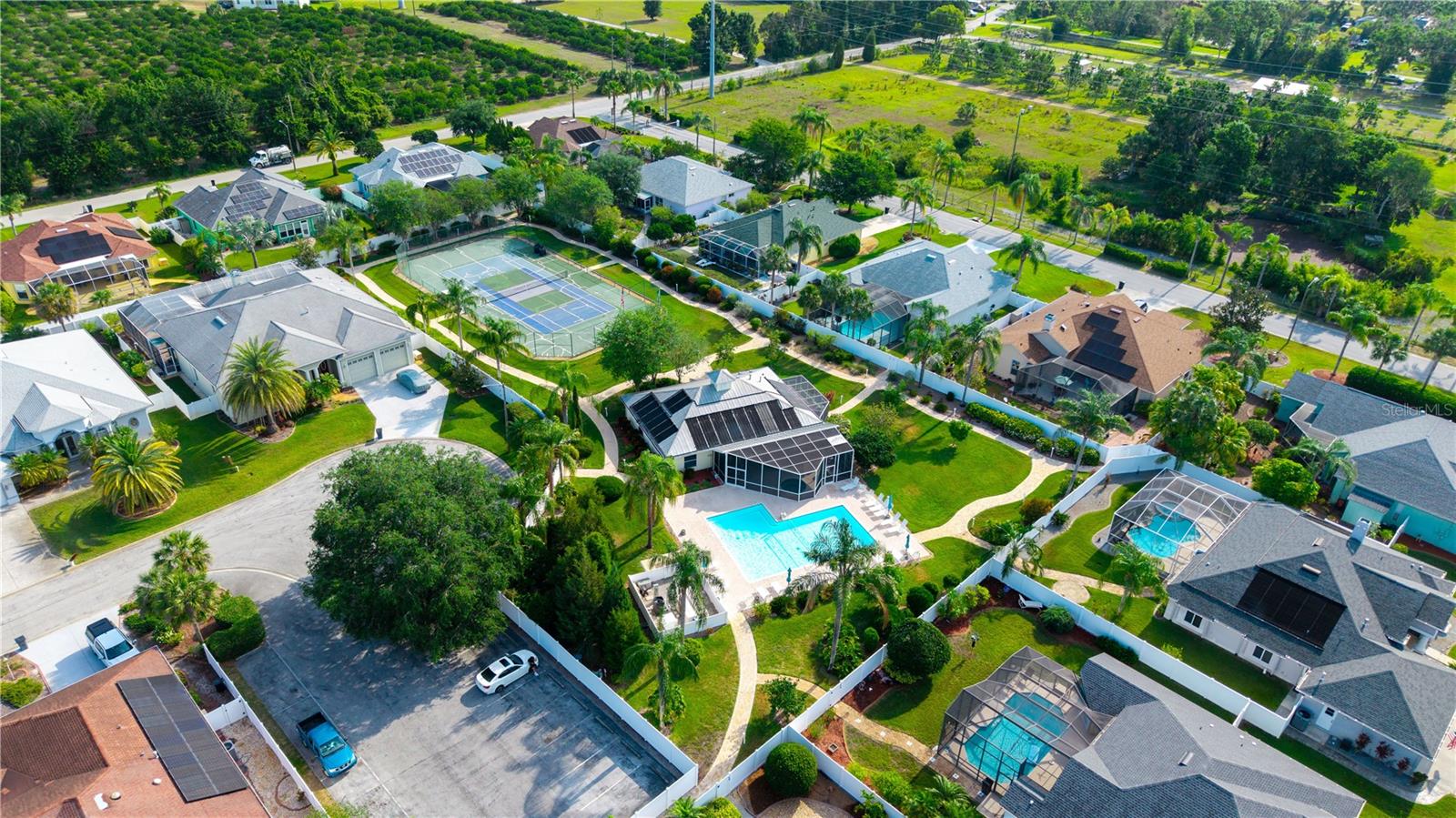 Notice the overflow parking area for guests and residences while they are using the community pool. You must wear clothes in the parking lot but you can disrobe once you go through the fence to the pool area and club house.
