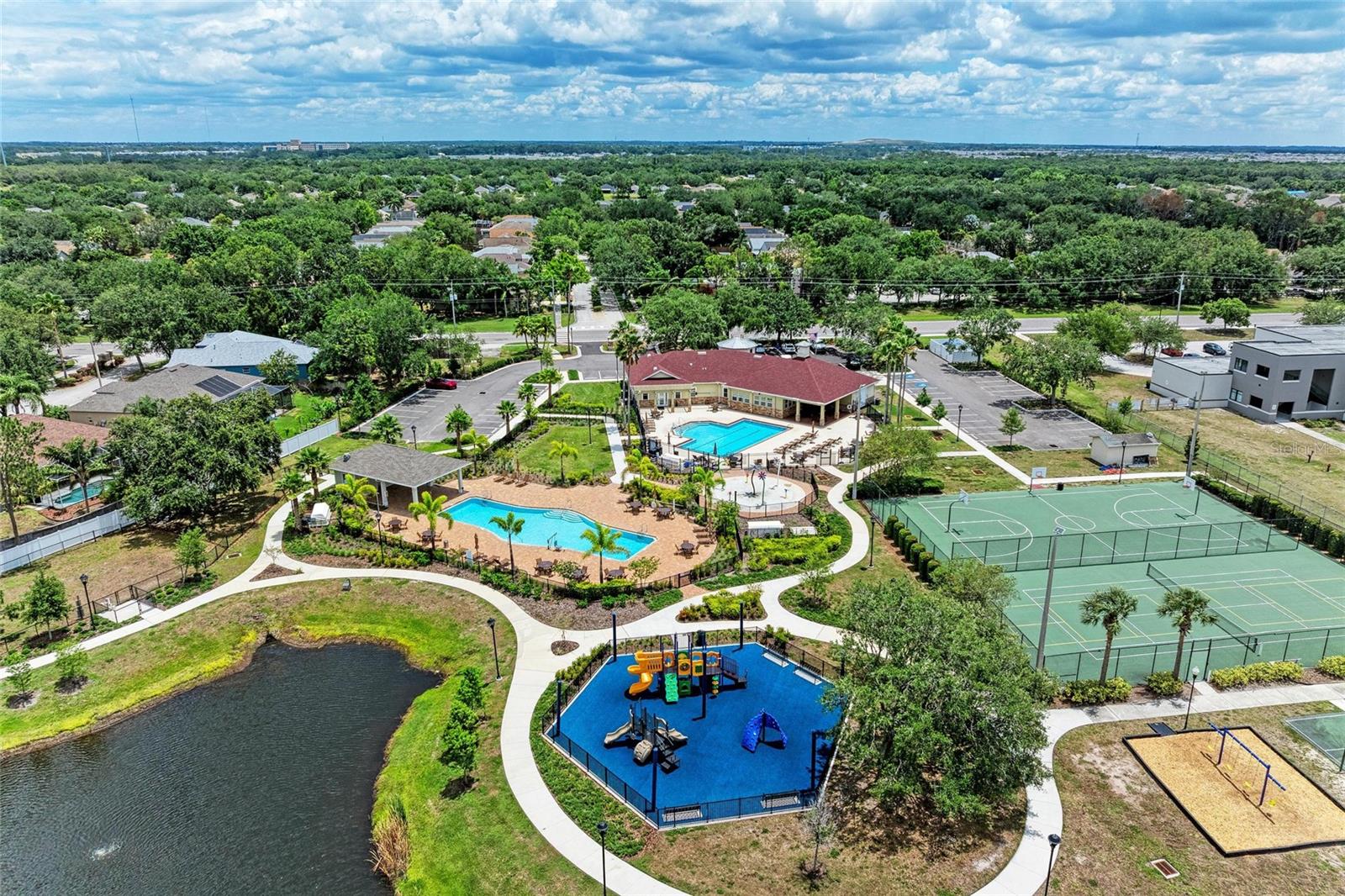 Community Center with 2 pools, tennis courts, basketball court, playground