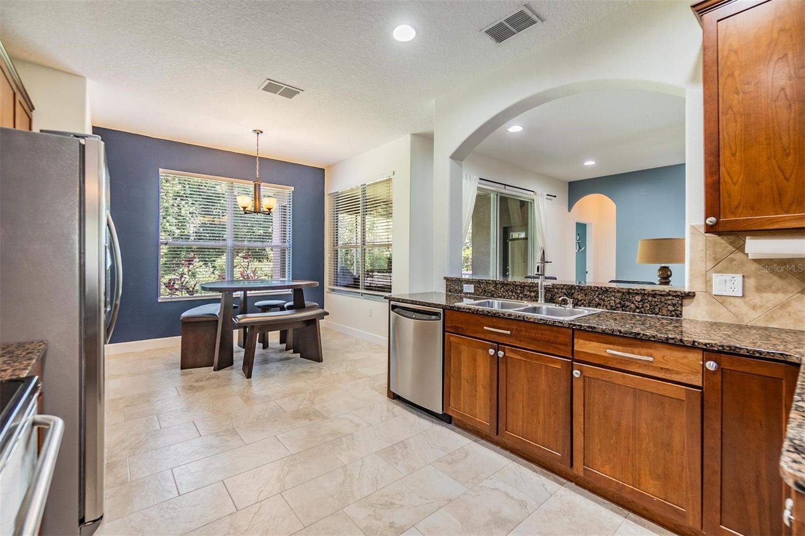 Great use of space in the kitchen with a sunny breakfast nook with a private view
