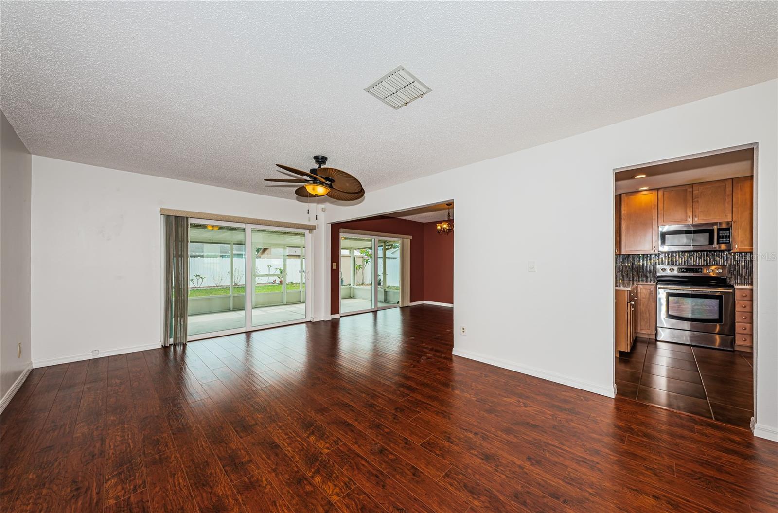 Living Area with Entry to Dining and Kitchen