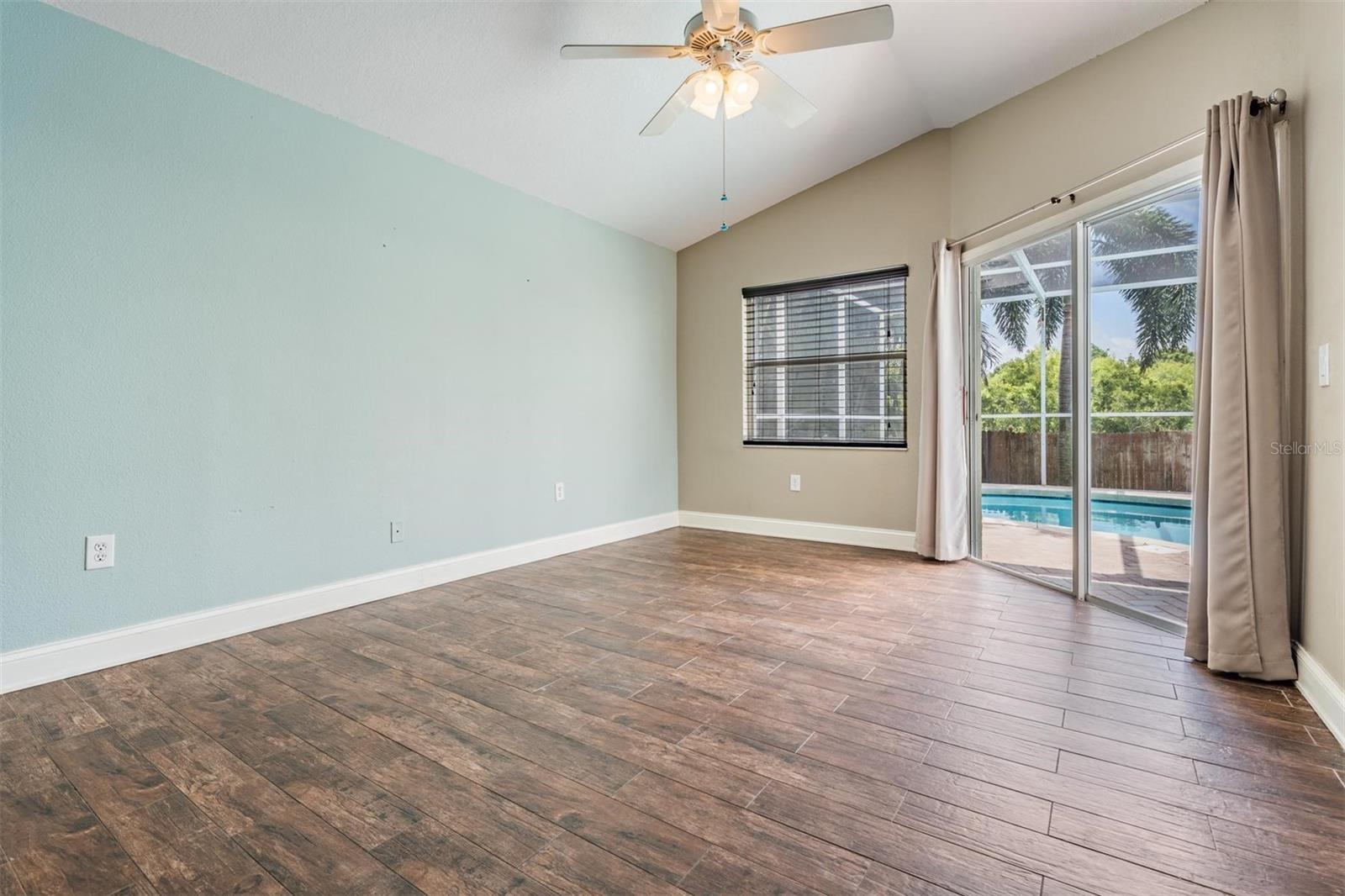 Oversized master with direct access to lanai and pool