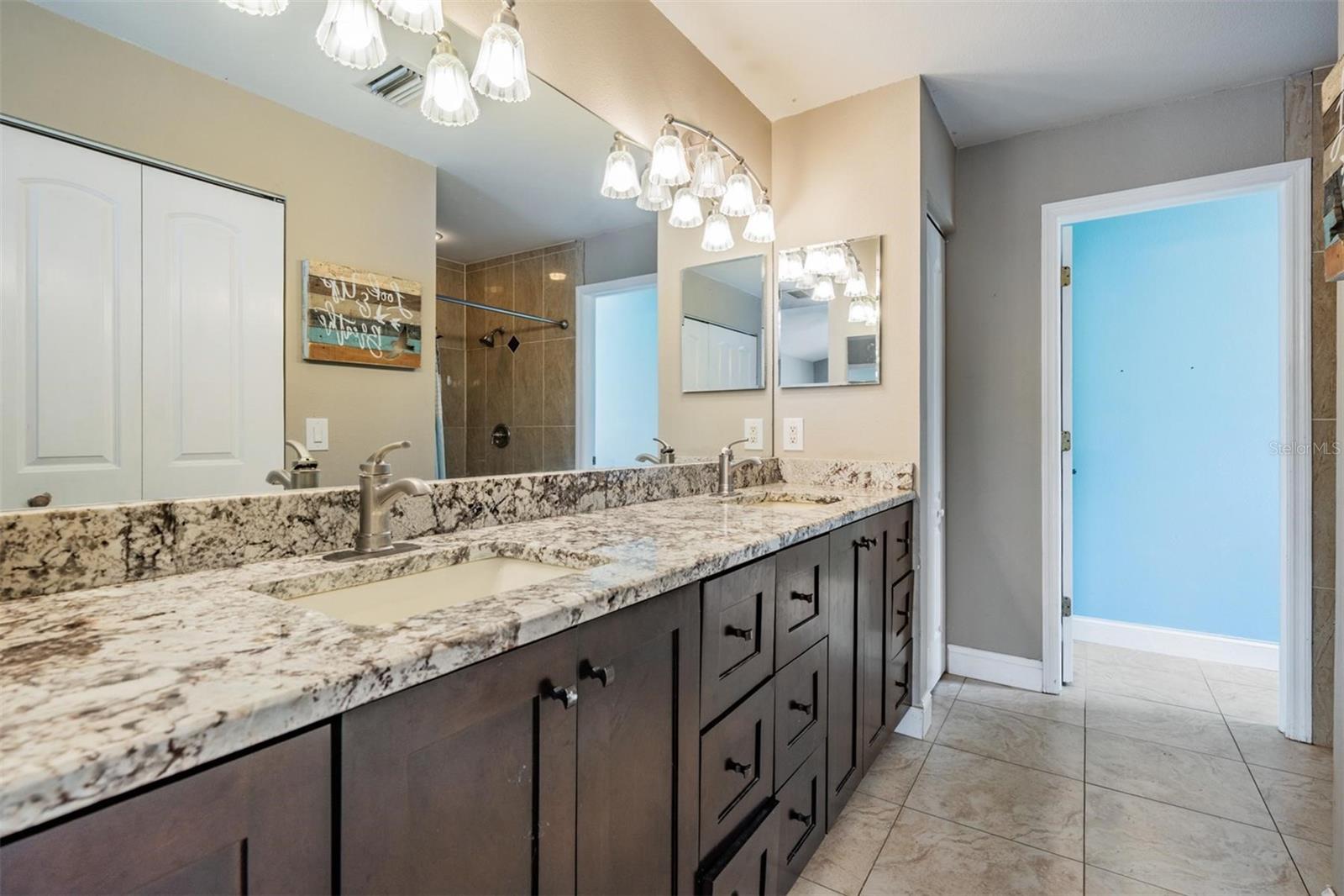 Granite countertops and plenty of additional vanity storage