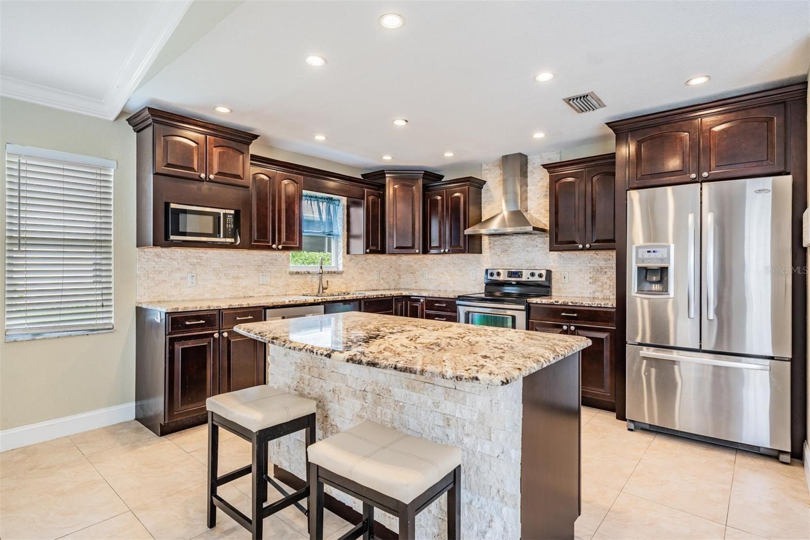 Rich cabinets and all stainless appliances