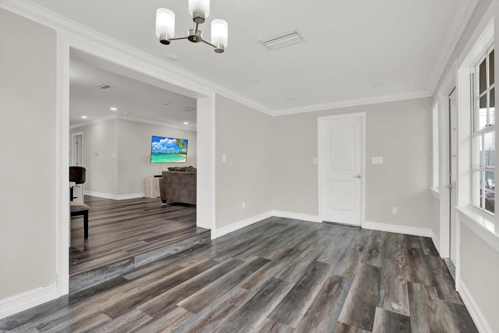 Den with access to carport & laundry room