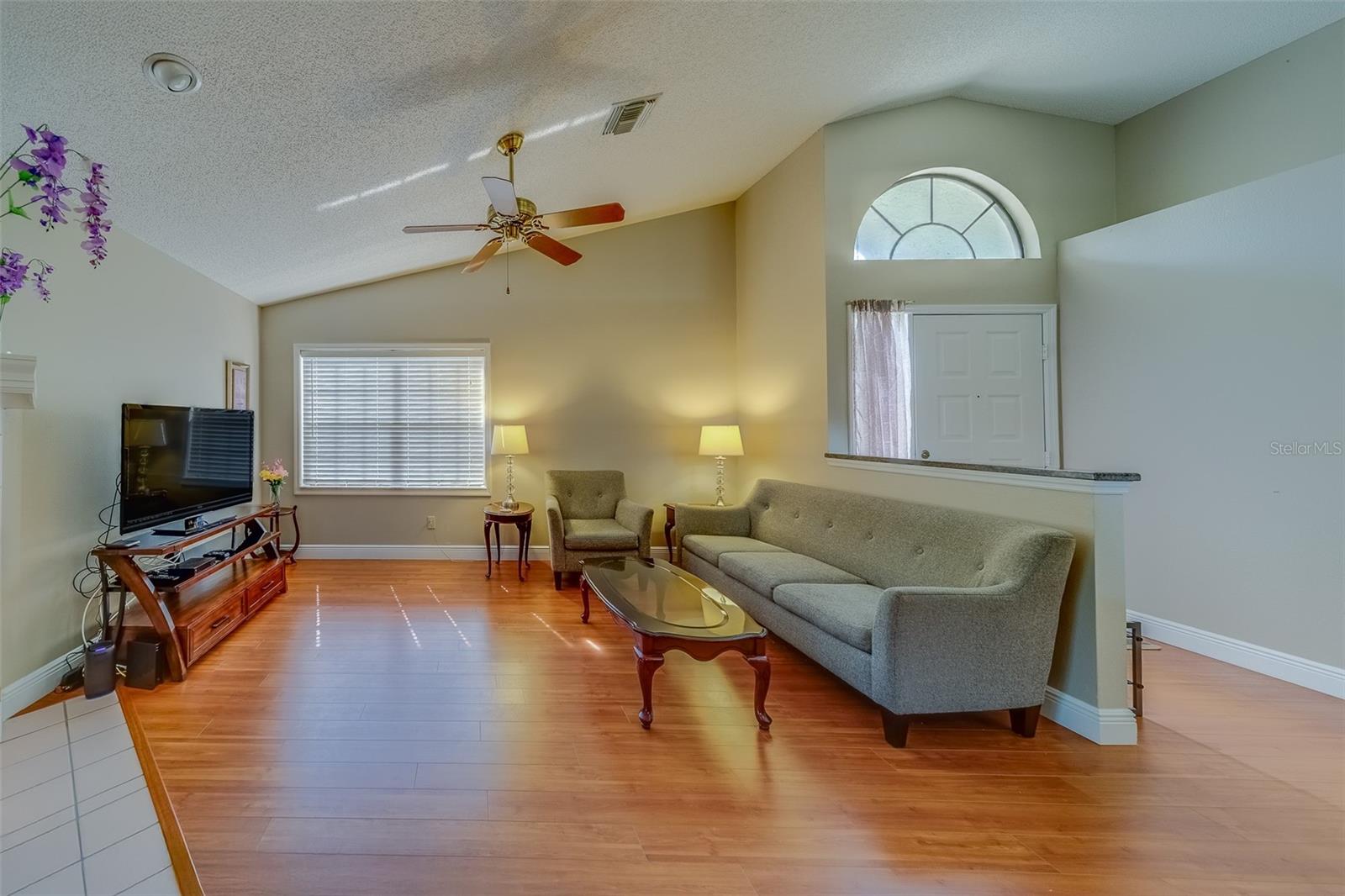 DINING AND LIVNG ROOM WITH HIGH CEILINGS