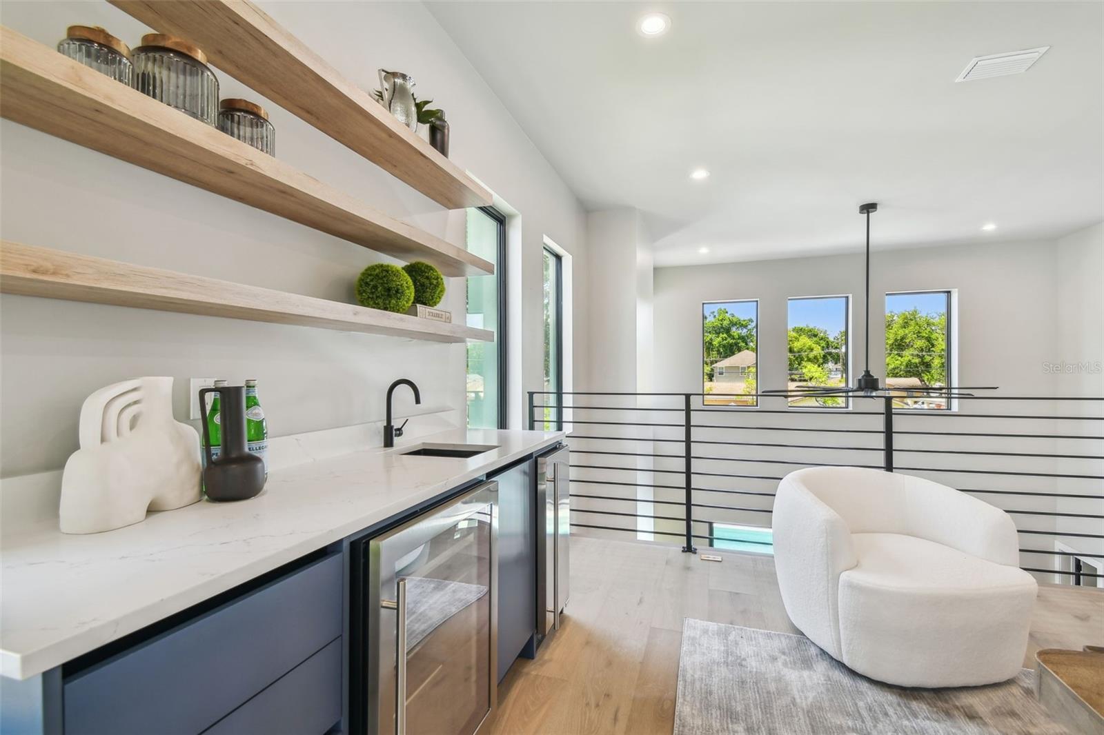Wetbar includes  ice maker and beverage refrigerator