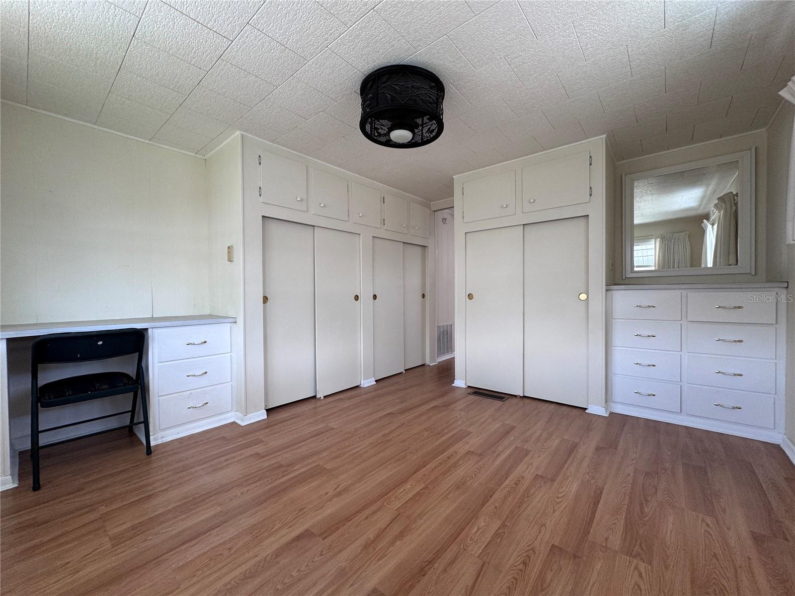 Primary bedroom has built in storage.