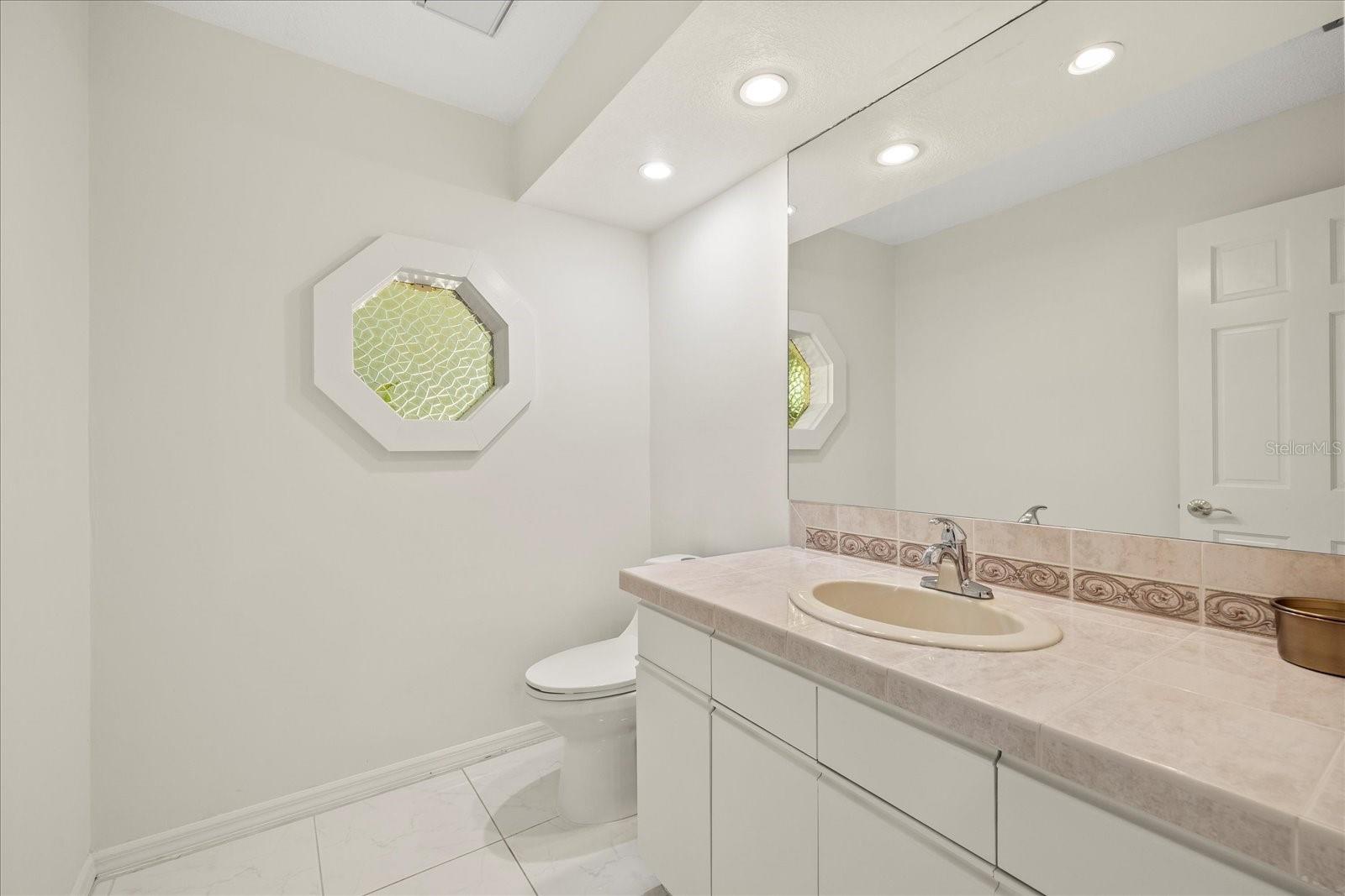 1/2 bath large enough to install a shower making it a 3rd full bath.