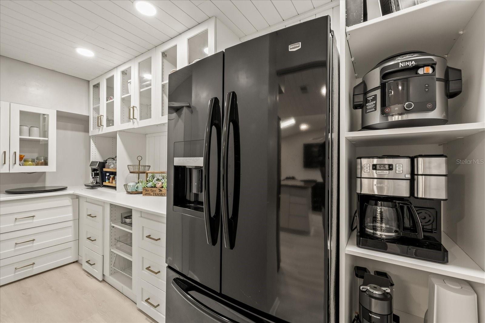 Incredible walk in "pantry" with 2nd fridge and tons of room for all of your Chef mini appliances.