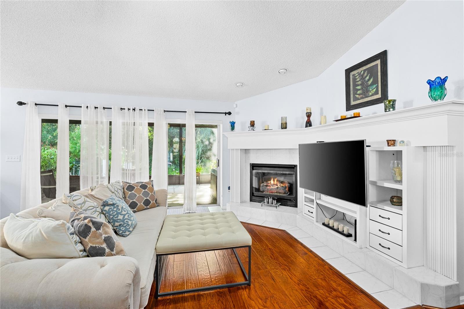 Cozy family room with genuine hardwood flooring