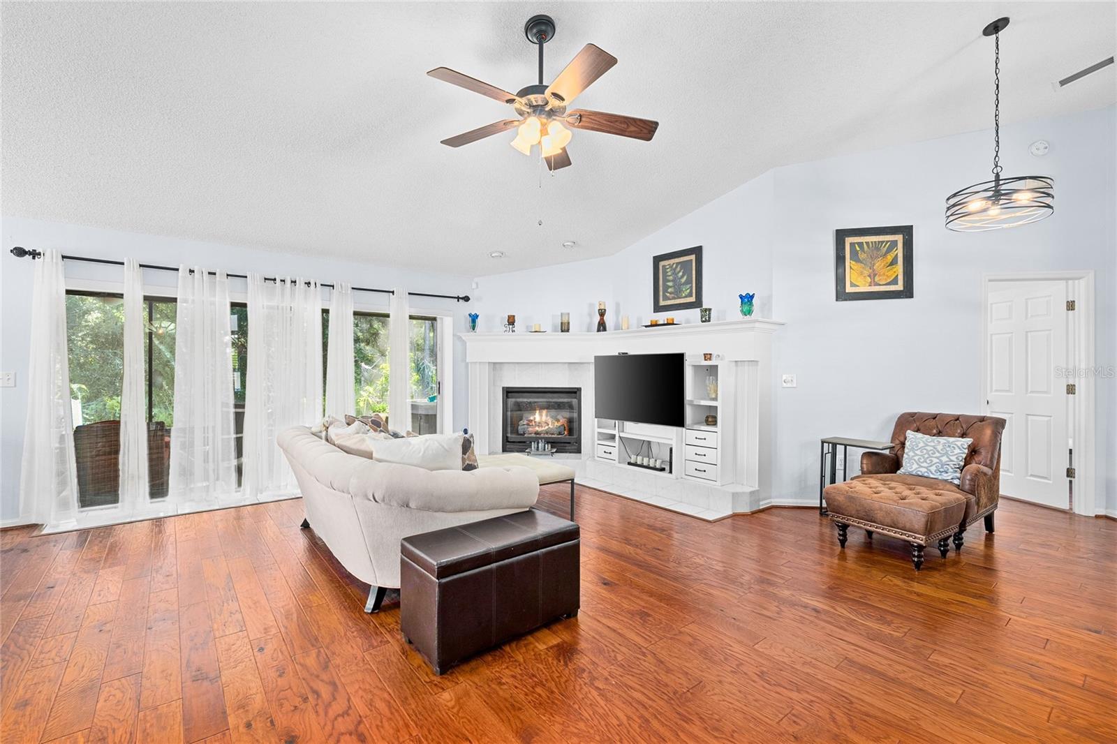 Family Room with custom built ins including a gas fireplace
