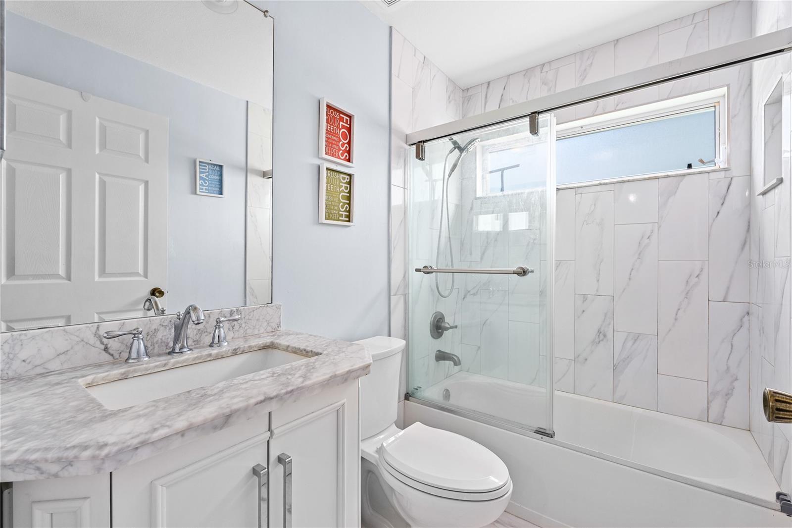 2nd Bathroom with updated Tile, lighting, and fixtures
