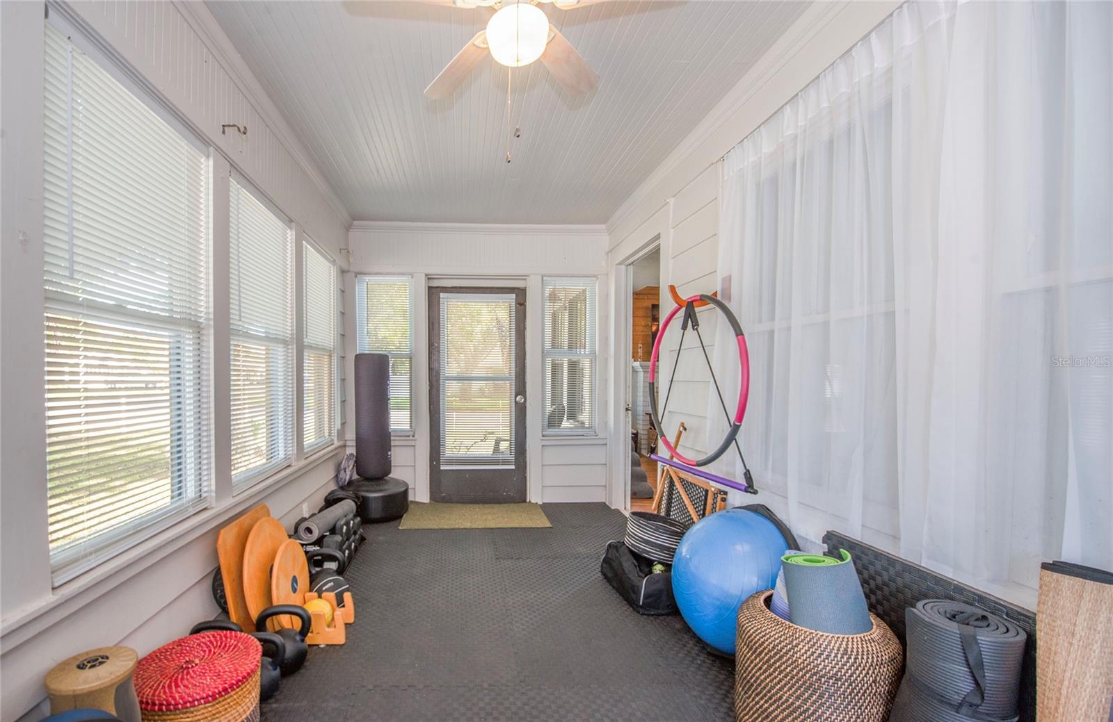 front enclosed porch with wall AC unit