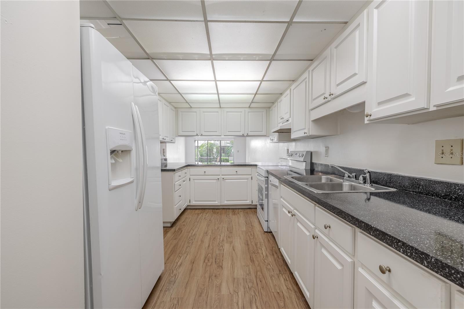 The kitchen features a pass thru to the dining room.