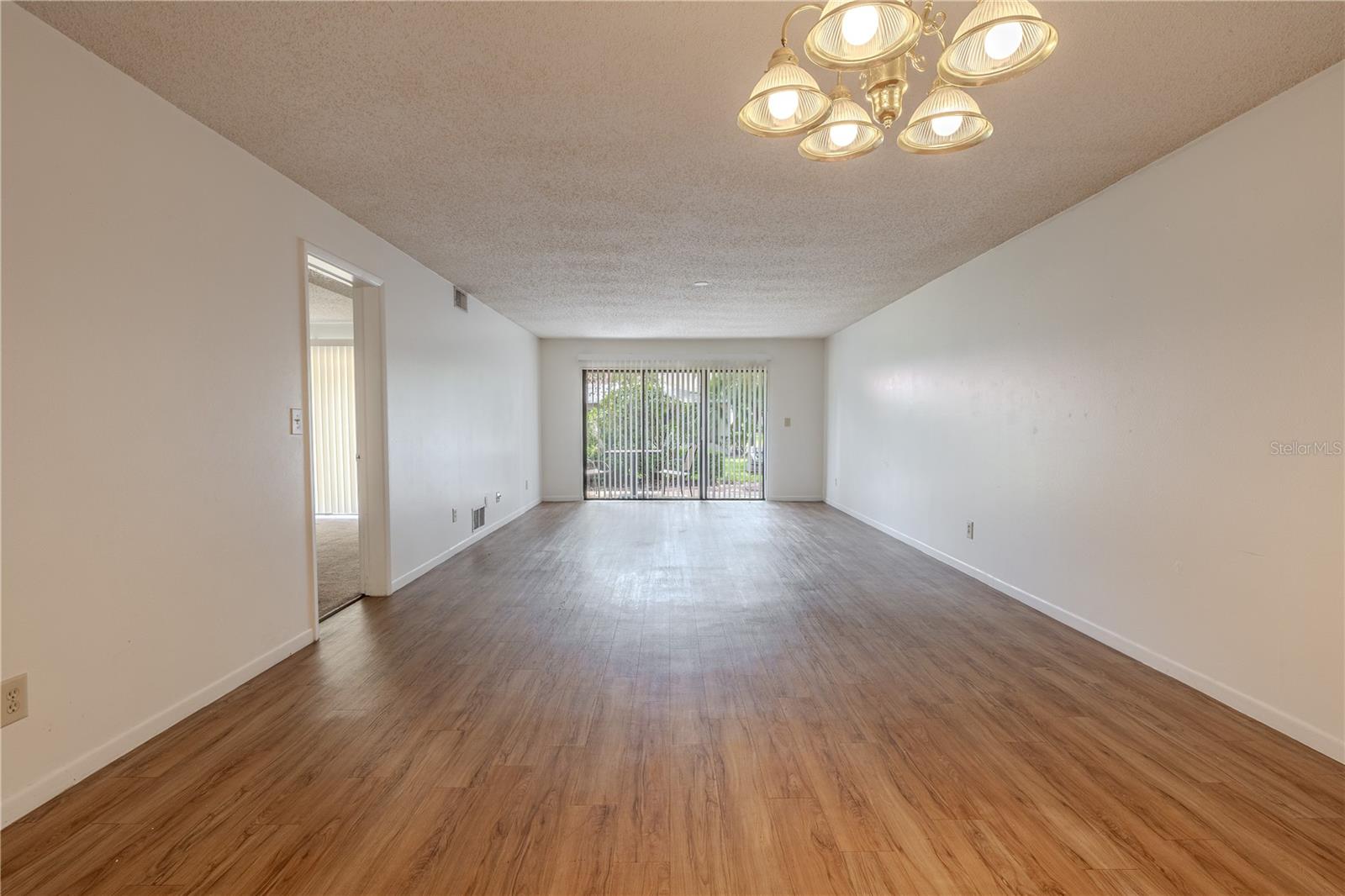 The dining room features a 5-globe  light fixture.
