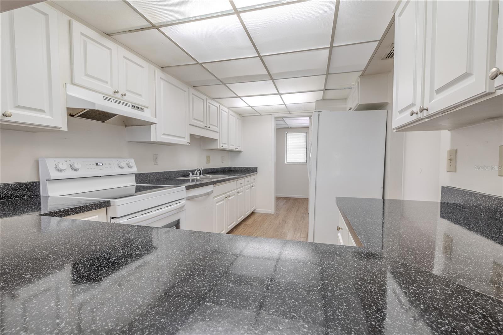 The kitchen features laminate flooring.