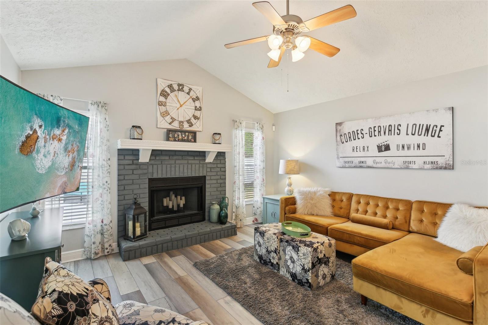 COZY LIVING ROOM WITH REAL WOOD BURNING FIRE PLACE
