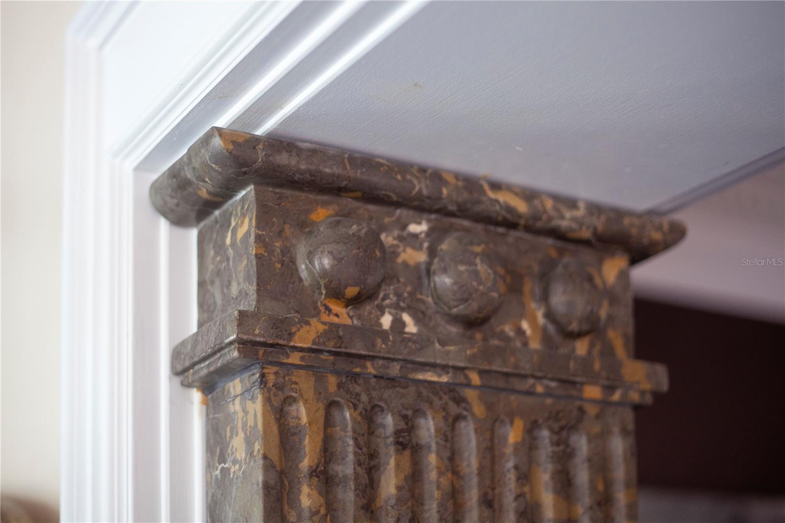 Hand carved marble architectural detail in the dining room