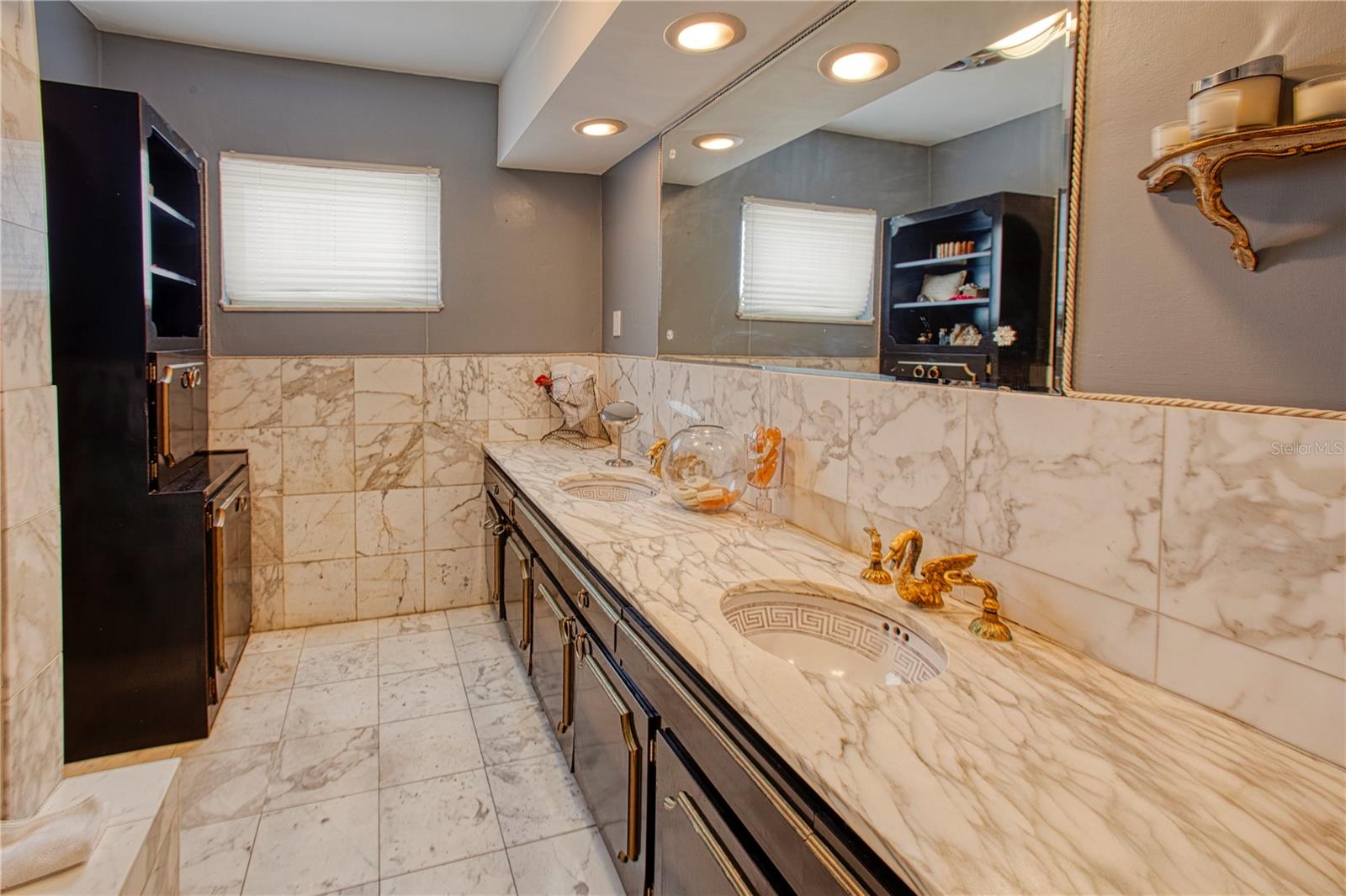 The marble upstairs primary bath