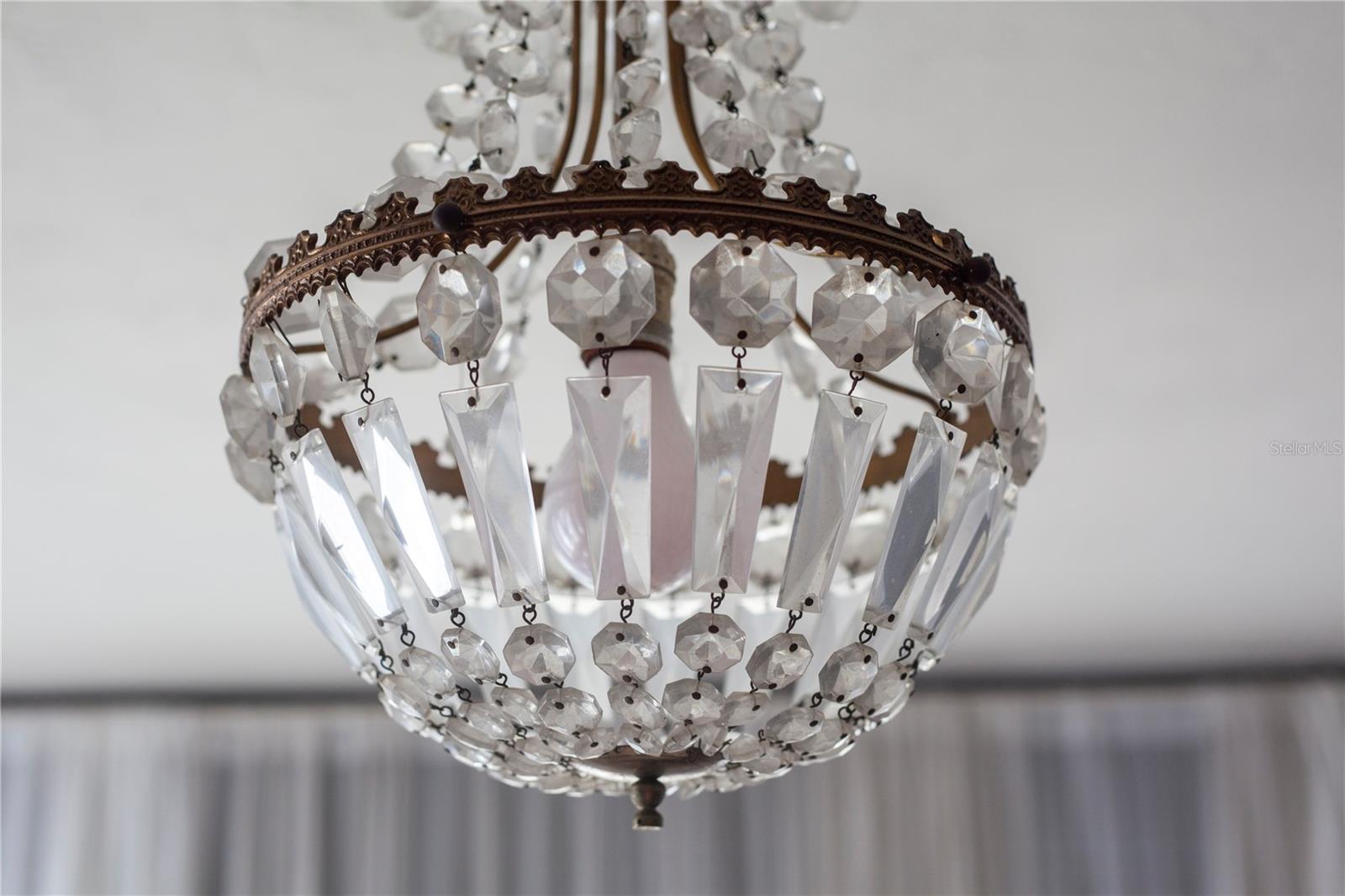 Unique vintage chandeliers are throughout the house