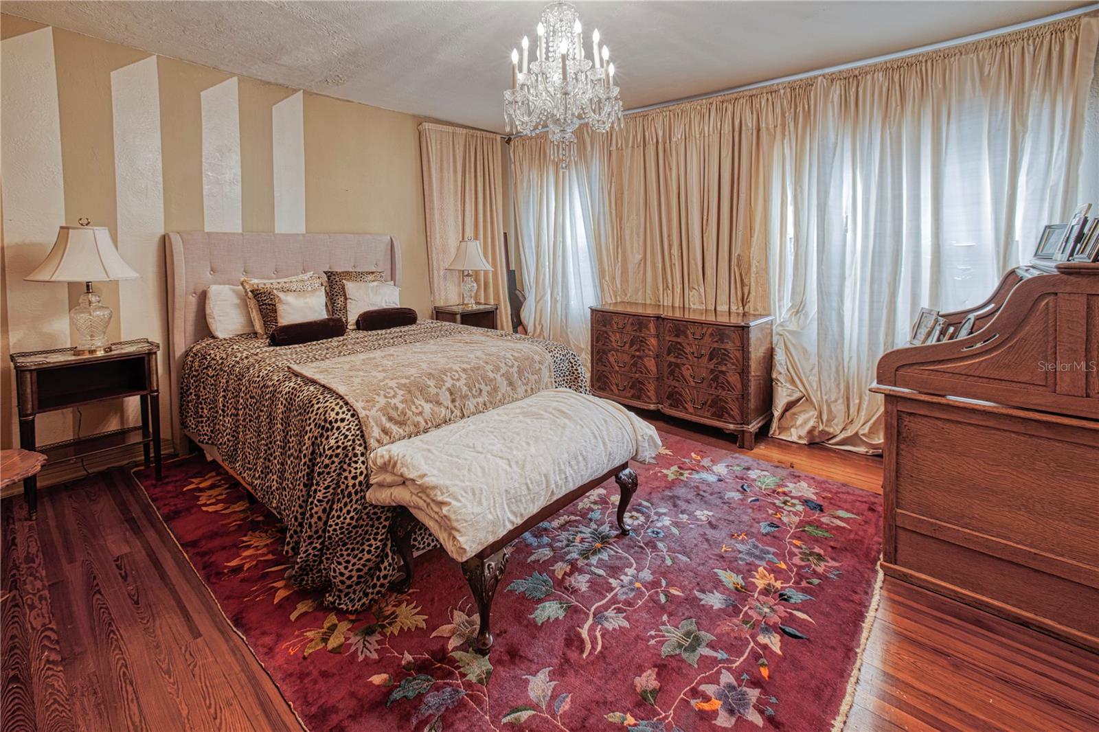 The third upstairs bedroom with original wood floor